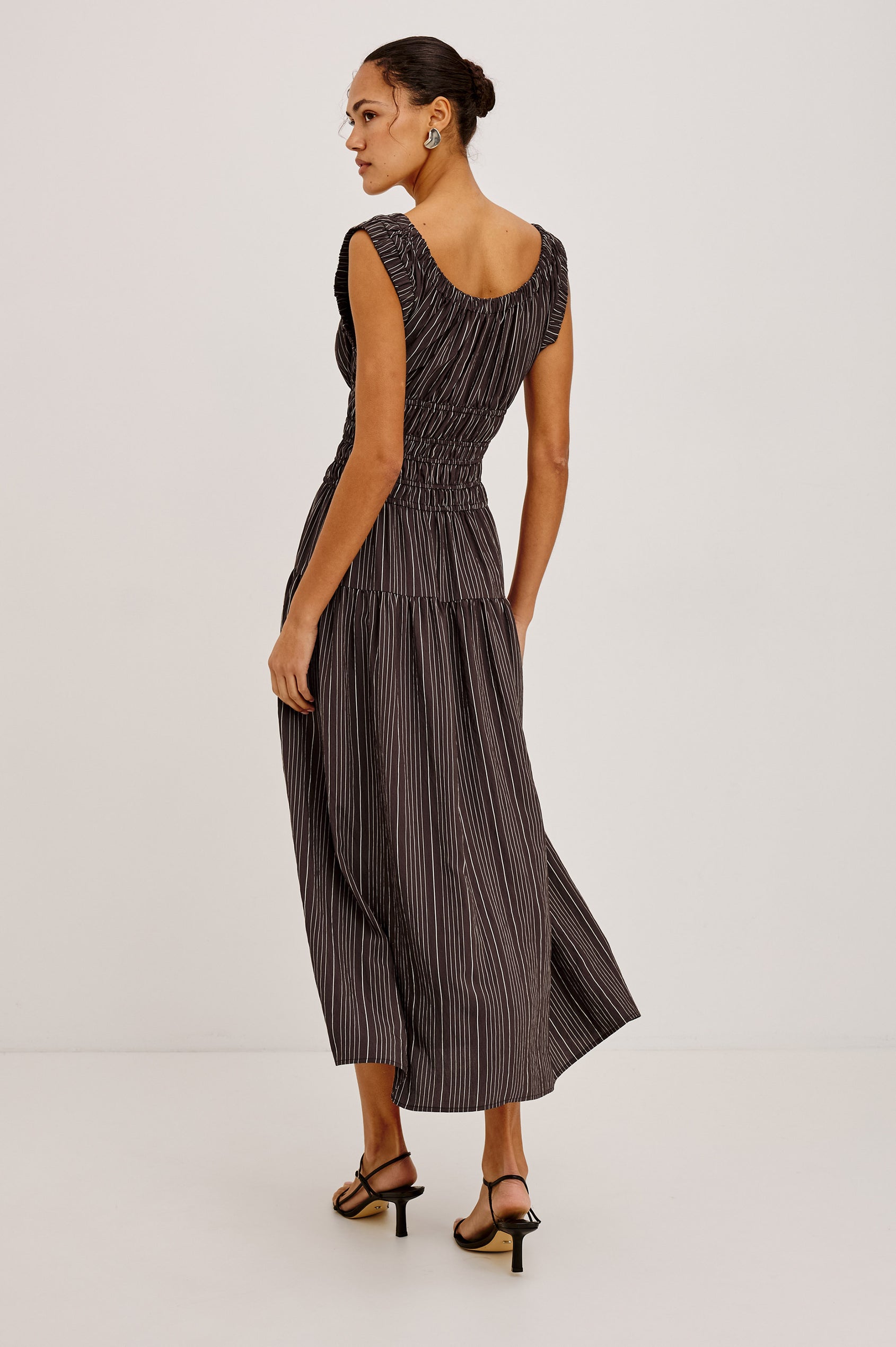 Anastasia Midi Dress With Elastic Scoop Neckline and Sleeveless Design, Laddered Waist Elastic, and Lined Single Tiered Skirt in Chicory Stripe Colorway - Full Body Back View Featured on Model