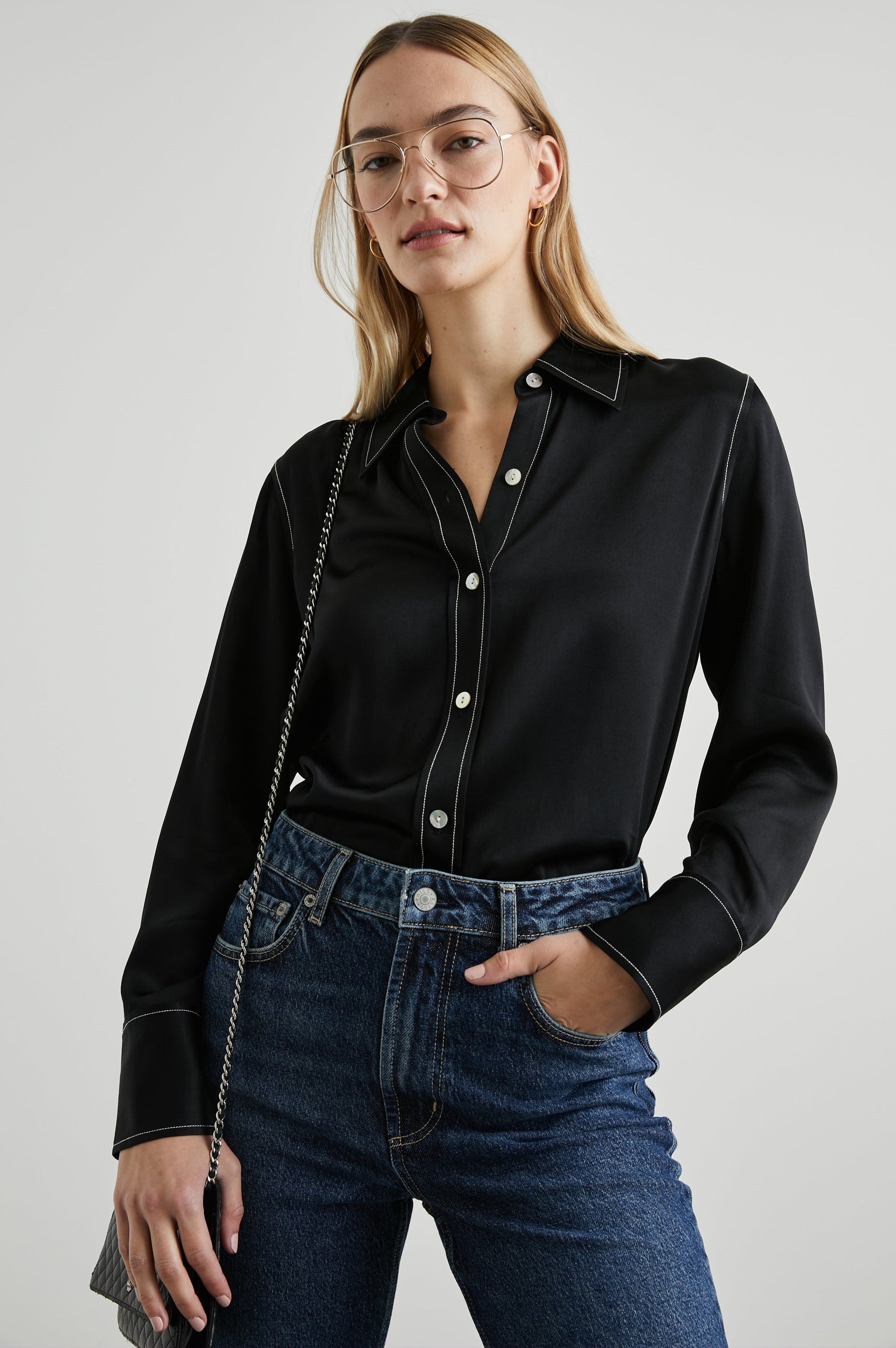 Andrea Long Sleeve Button Up in Black Colorway, with White Stitching at Trim - Front Tucked View Featured on Model 