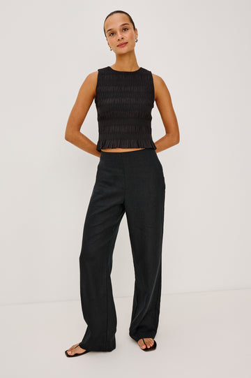 Andrine Pant in Heavy Linen With High-Waisted Fit, Straight Legs, Unlined, Side On-Seam Pockets, Side Zip Closure in Black Colorway - Full Body Front View Featured on Model