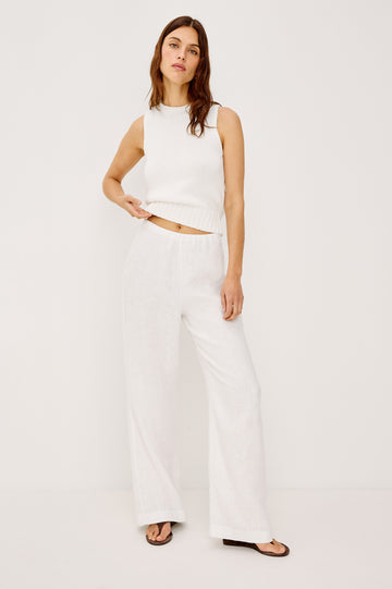 Andrine Pant in Heavy Linen With High-Waisted Fit, Straight Legs, Unlined, Side On-Seam Pockets, Side Zip Closure in White Colorway - Full Body Front View Featured on Model