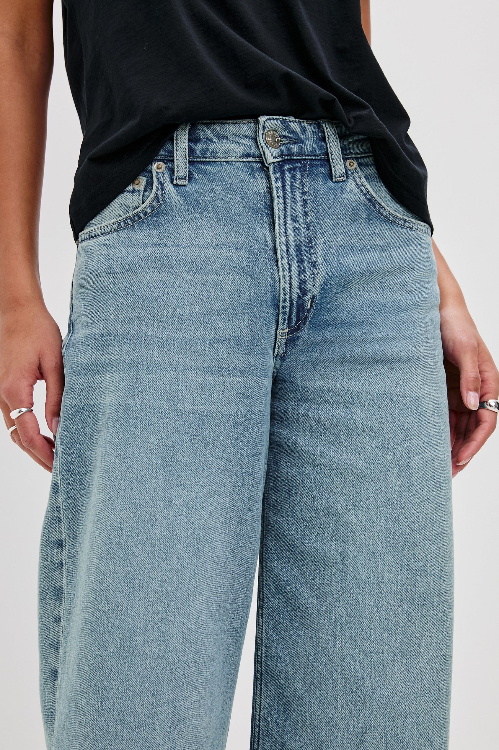 Angeleno mid right slouchy wide leg jean in light wash Blue Eyed Girl - close up of details on model