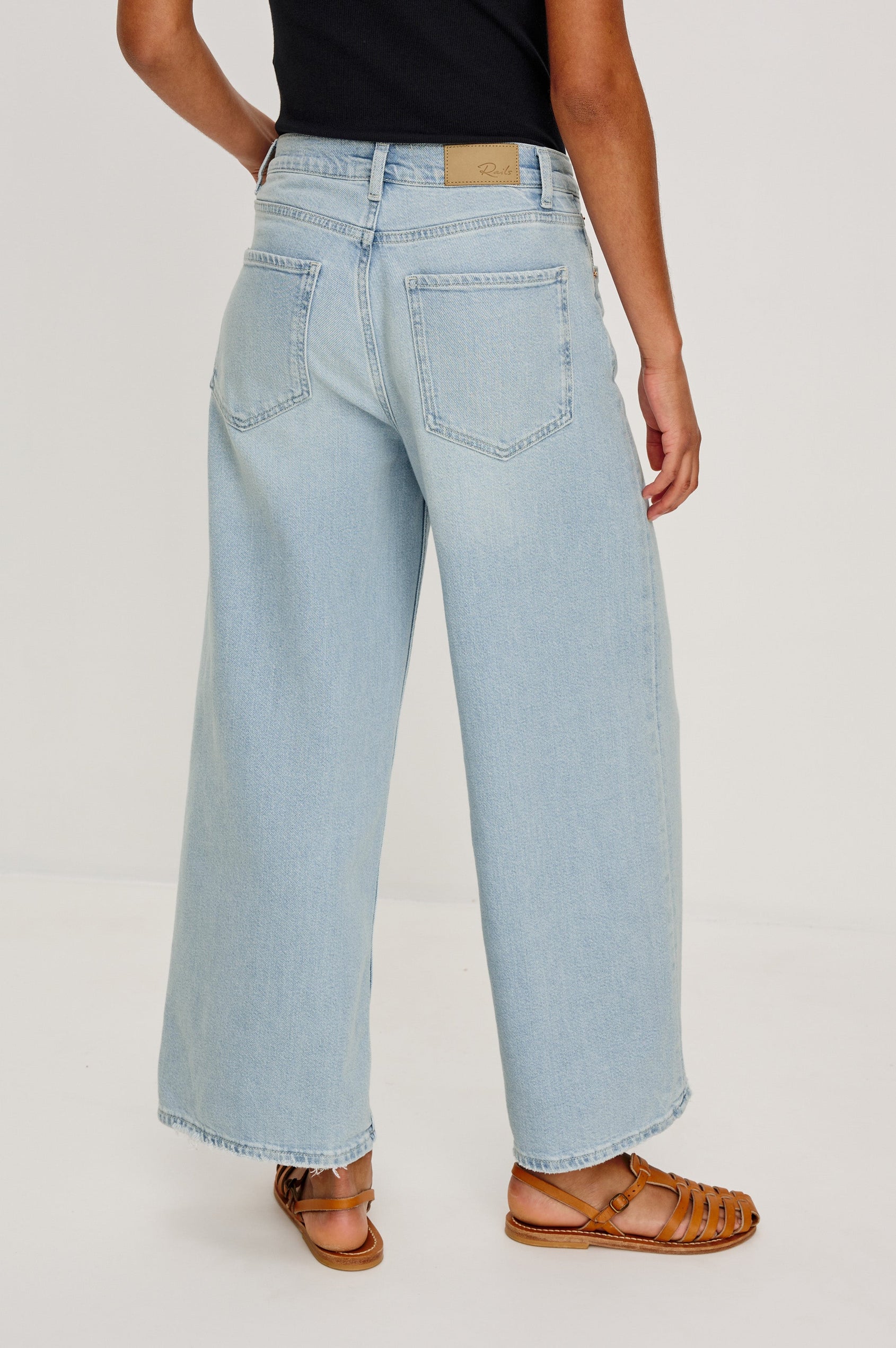 Angeleno Crop Denim Pant, Wide Leg, Five Pocket Zip Fly with a White Drawstring Tie at Waist in Light Wash Scuba Colorway. Back View Shown on Model.