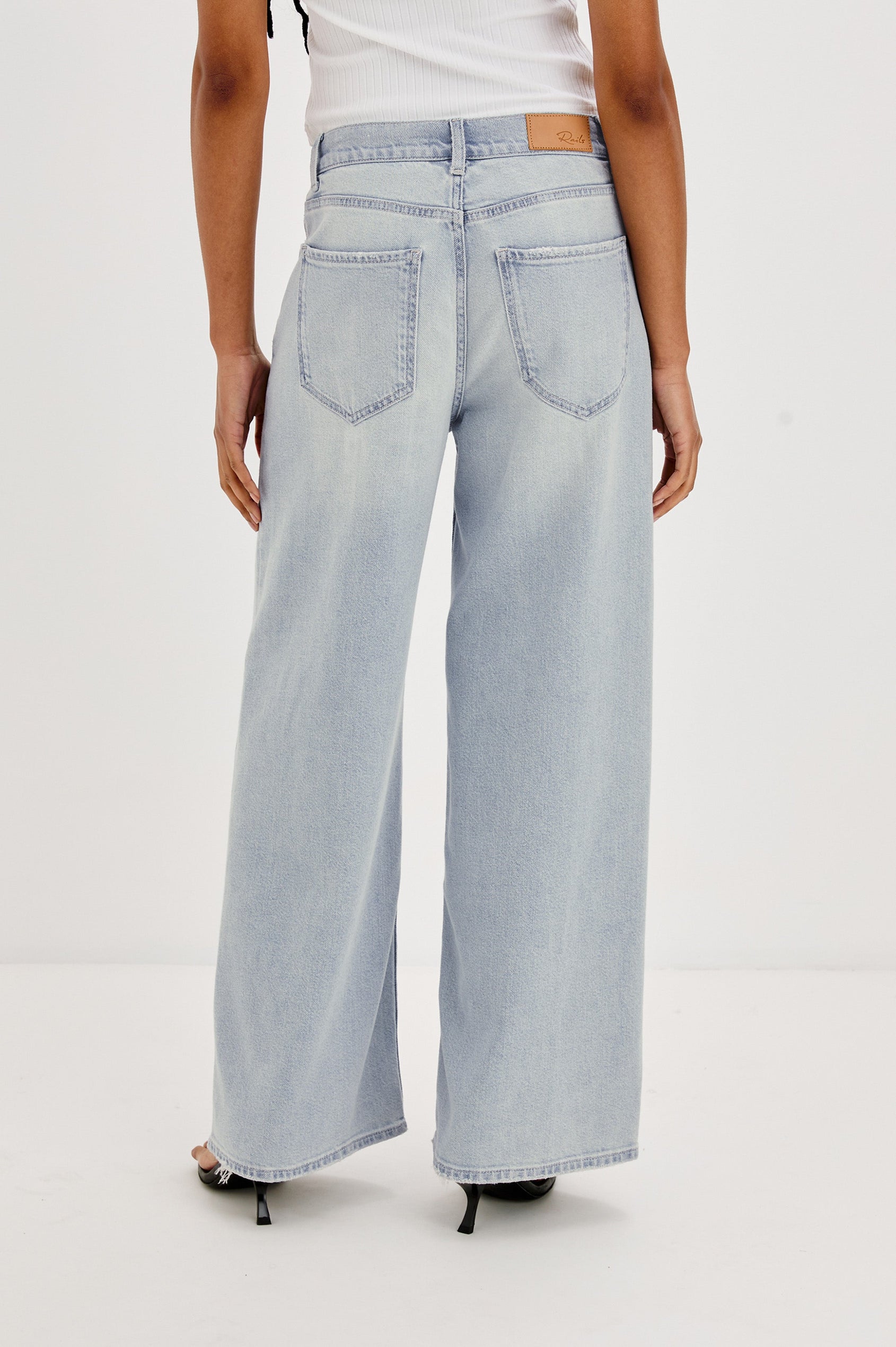 Angeleno Crop Denim Pant, Wide Leg, Five Pocket Zip Fly with a White Drawstring Tie at Waist in Light Wash Scuba Colorway. Back View Shown on Model.