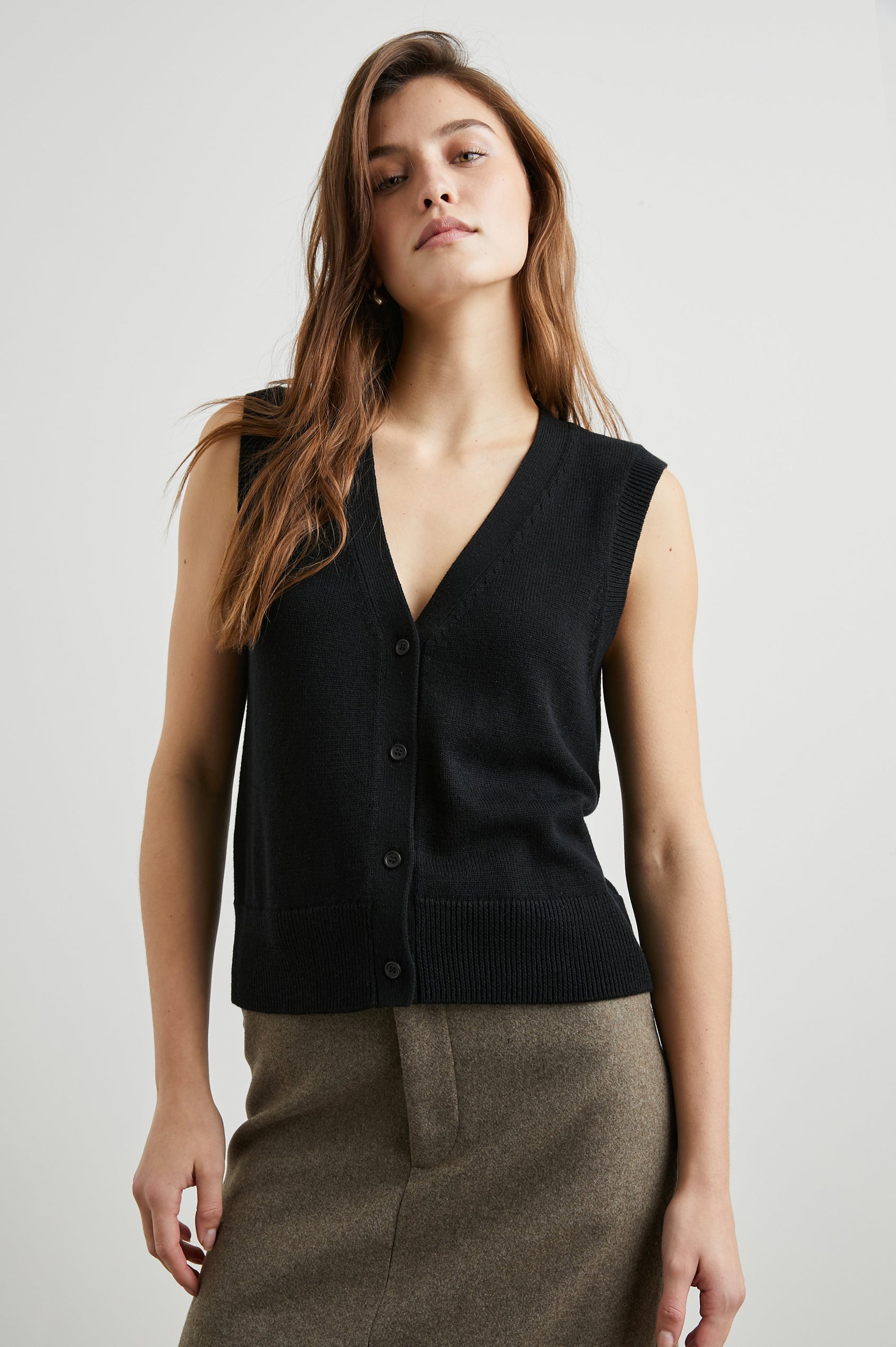 Annika Vest with a Deep V Neck and Button Closure in Jet Black Colorway - Front View Featured on Model 
