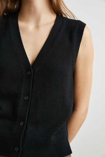 Annika Vest with a Deep V Neck and Button Closure in Jet Black Colorway - Front View Featured on Model 
