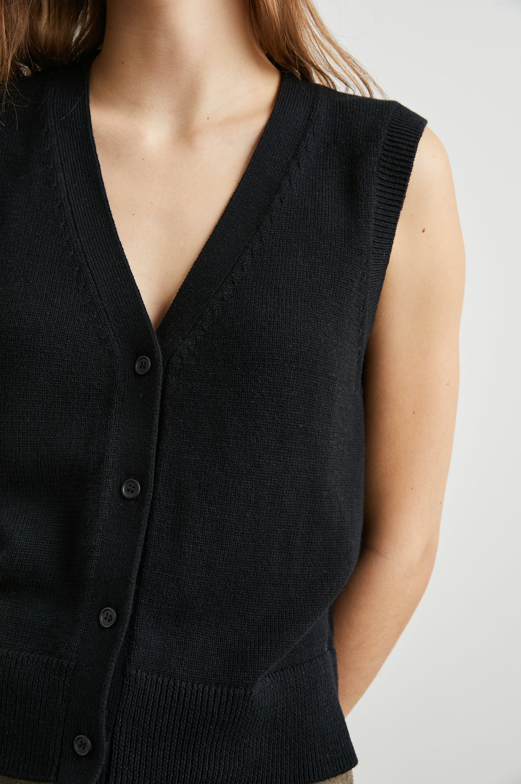 Annika Vest with a Deep V Neck and Button Closure in Jet Black Colorway - Front View Featured on Model 