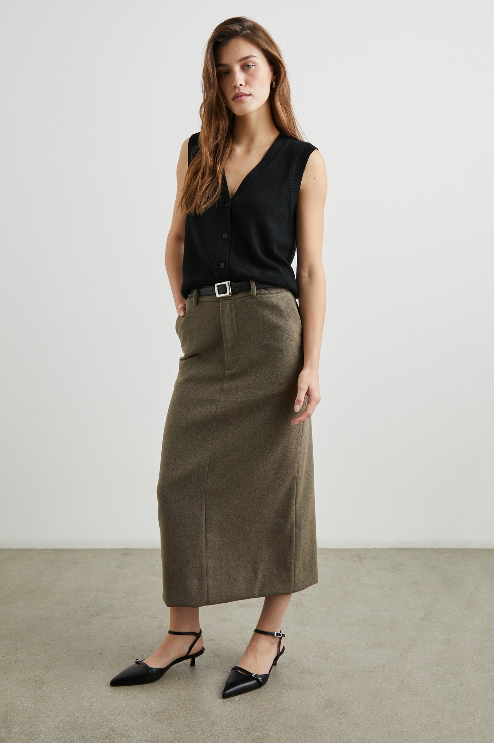 Annika Vest with a Deep V Neck and Button Closure in Jet Black Colorway - Front Full Body View Featured on Model 