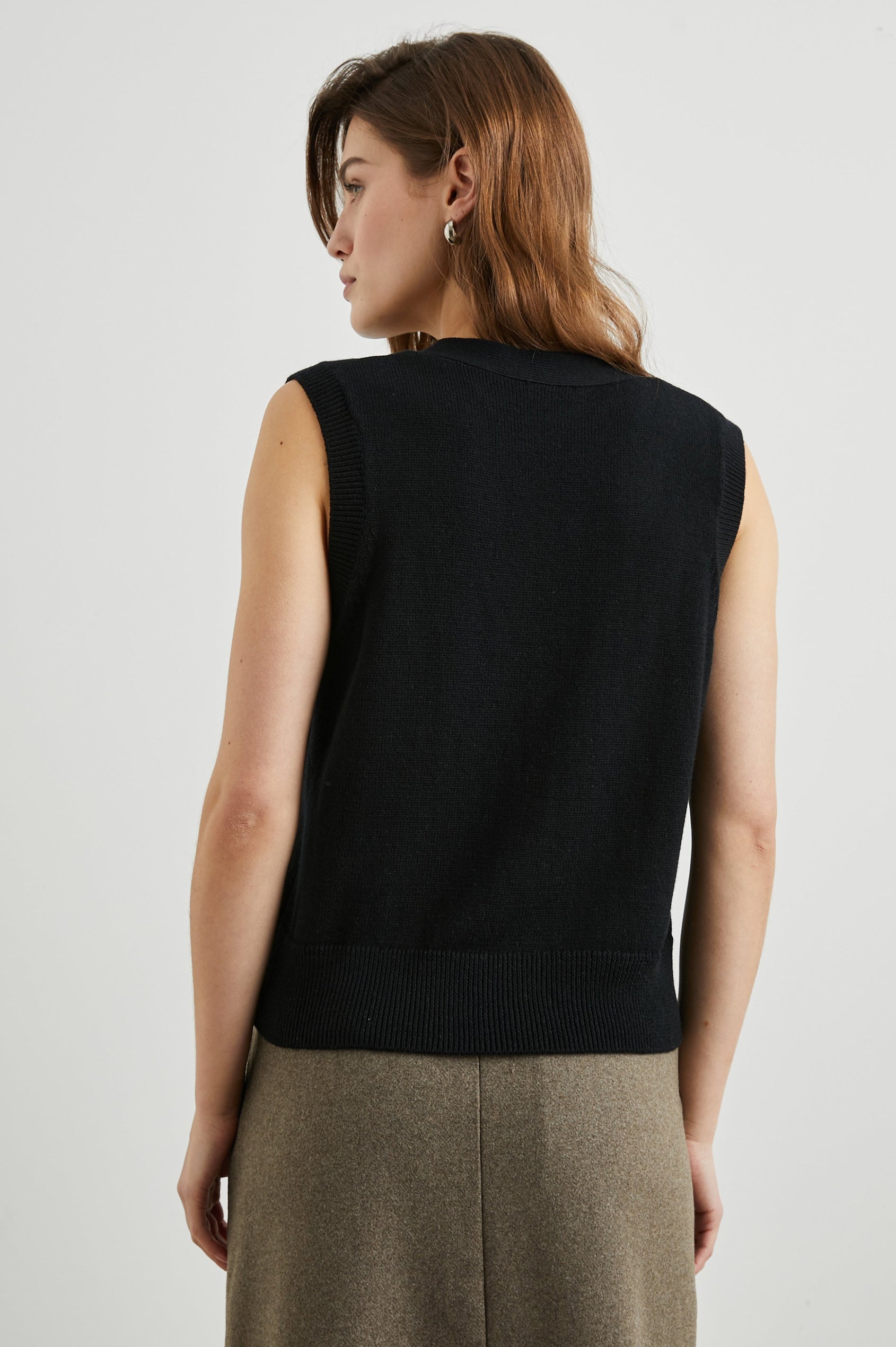 Annika Vest with a Deep V Neck and Button Closure in Jet Black Colorway - Back View Featured on Model 