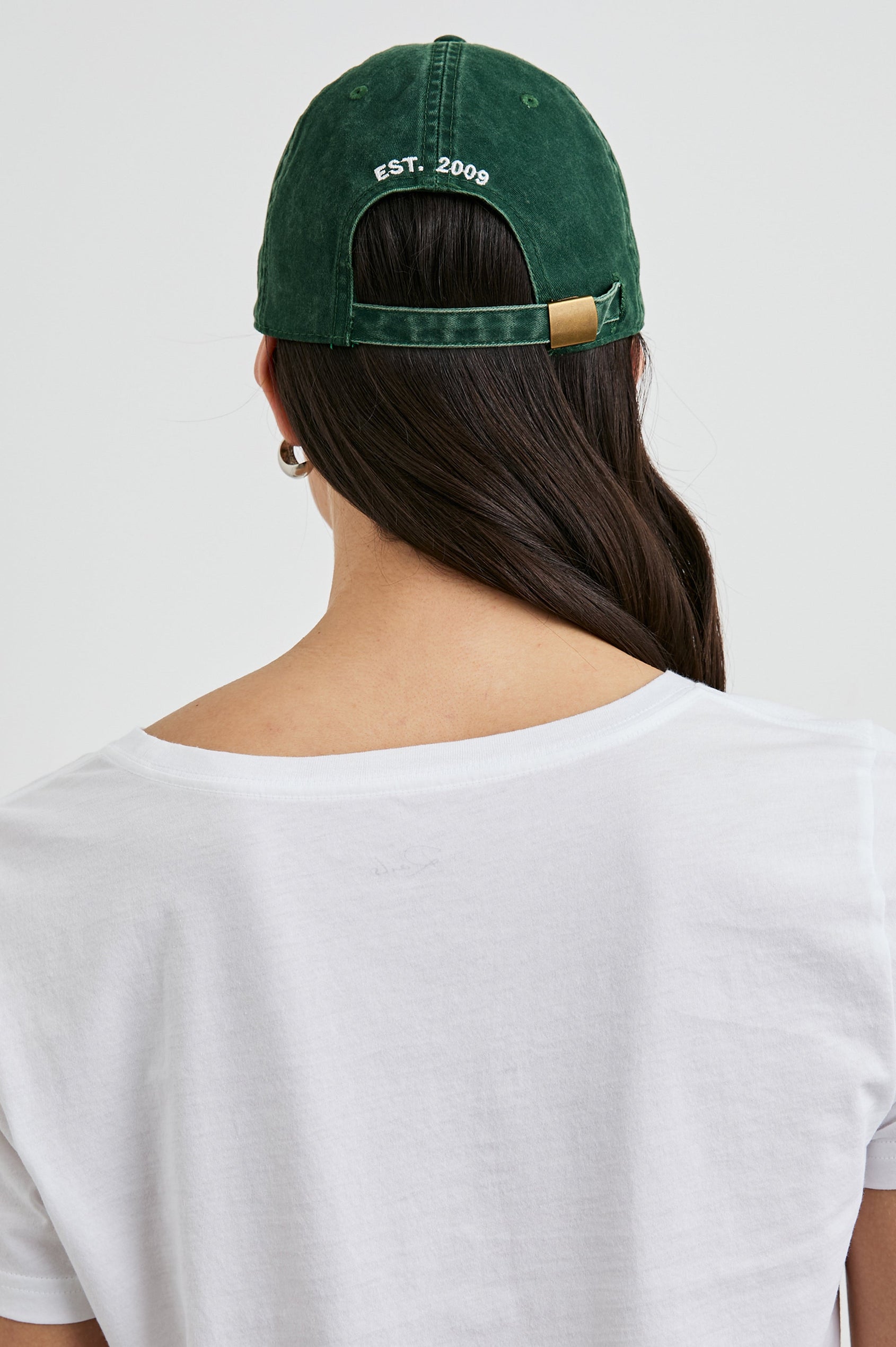 Anniversary Baseball Cap with an Adjustable Back Strap, Front Text, Rails, and Back Text, Est 2009, in Forest Colorway, with White Text - Back View Featured on Model