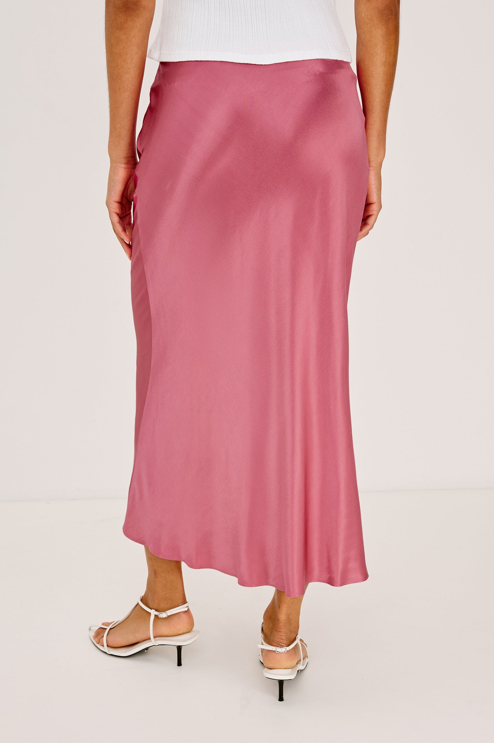 Anya High-Waisted Midi Skirt in Satin Crepe With Side Slit in Dark Rose Colorway - Full Body Back View Featured on Model