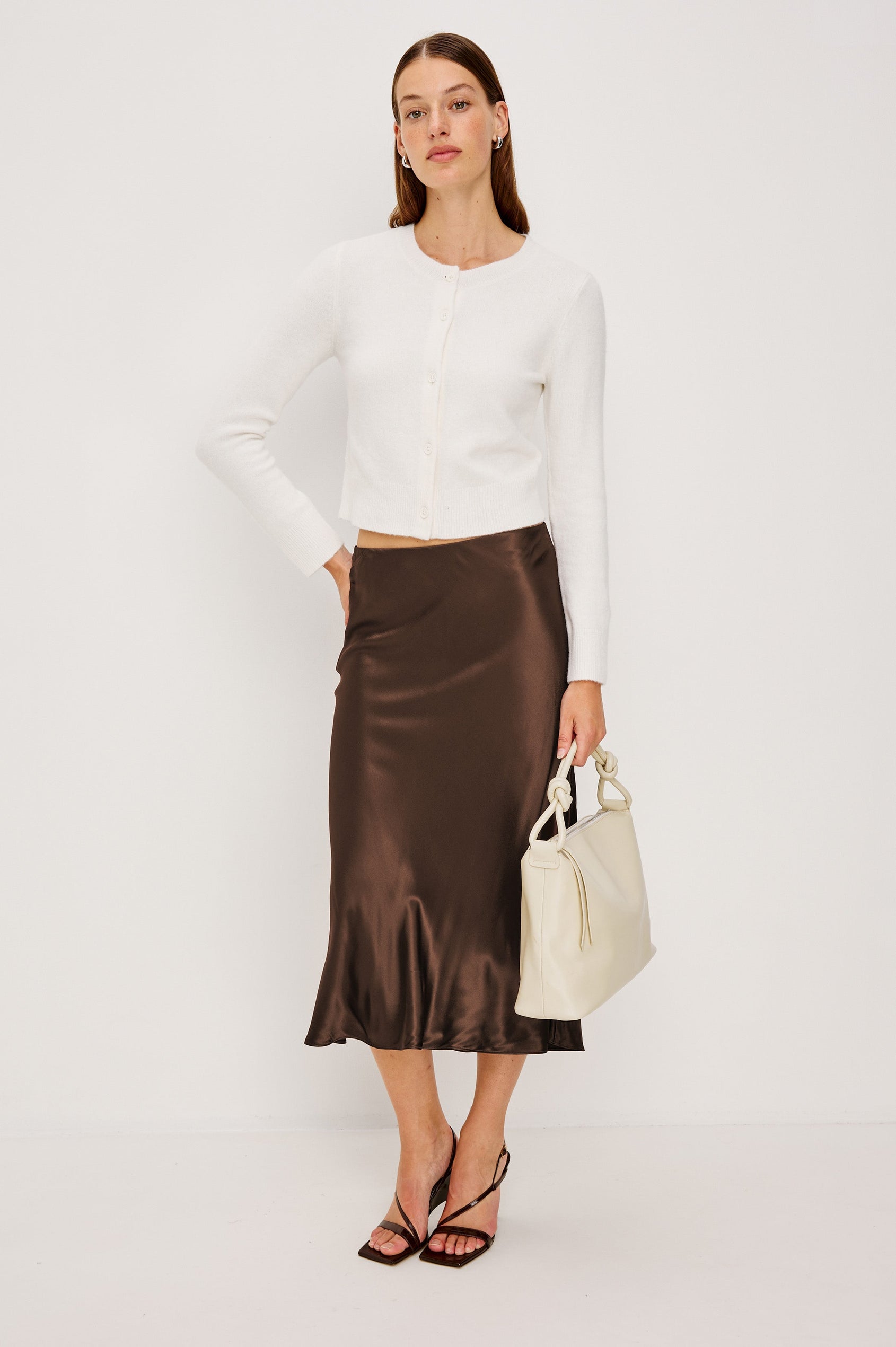 Anya High-waisted Midi Skirt in Espresso Brown Colorway - Full Body Front View Featured on Model, Holding Purse