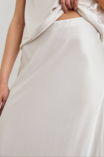 Anya High-waisted Midi Skirt in Ivory Colorway - Front View Featured on Model