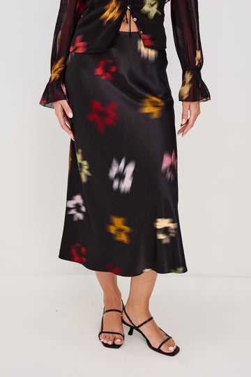 Anya High-waisted Midi Skirt in Onyx Blurred Floral Colorway - Front View Featured on Model, lower half of body