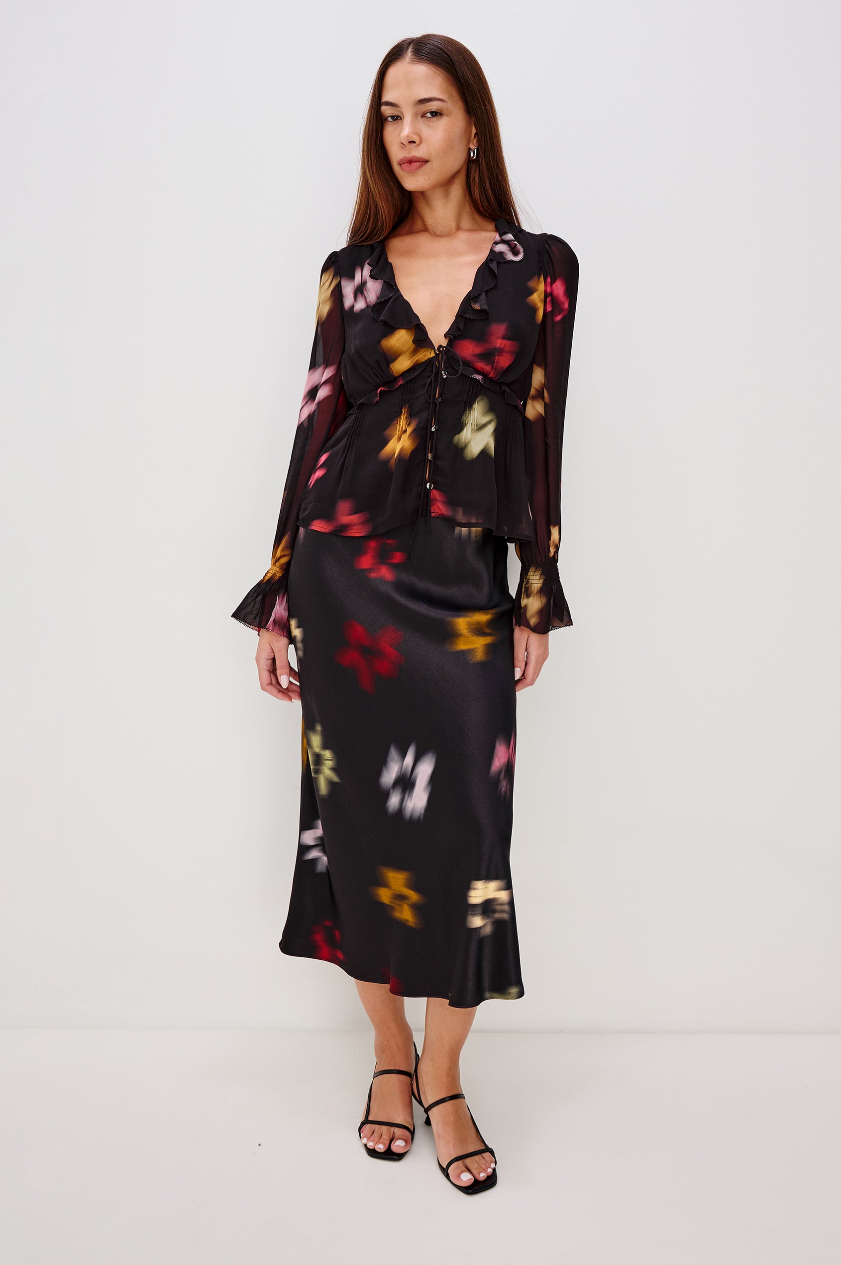 Anya High-waisted Midi Skirt in Onyx Blurred Floral Colorway - Ful Body Front View Featured on Model