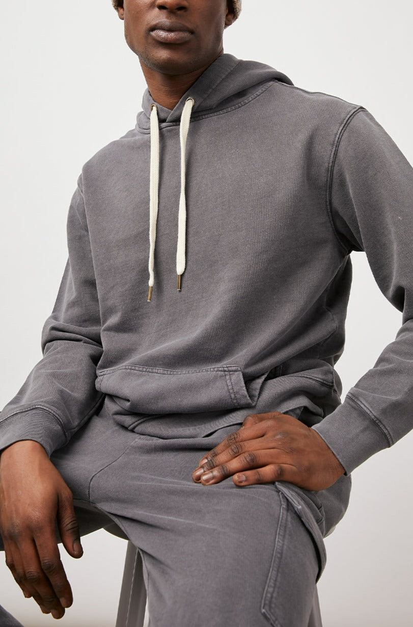 APOLLO CHARCOAL FROST HOODIE- MODEL SITTING FRONT