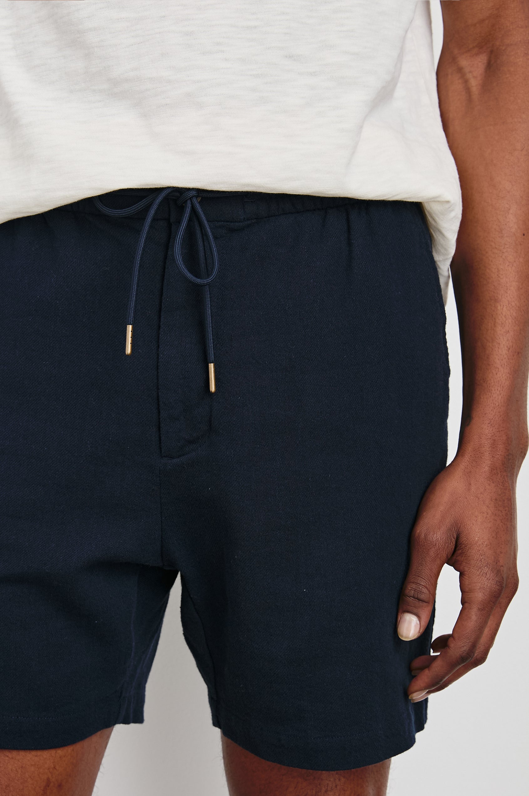 Archer Short in Cotton-Linen Blend With Relaxed Fit, Elastic Drawstring Waist, Front Zip Fly, Side Pockets, and Back Welt Pocket in Deep Meridian Colorway - Lower Body Front View Featured on Model