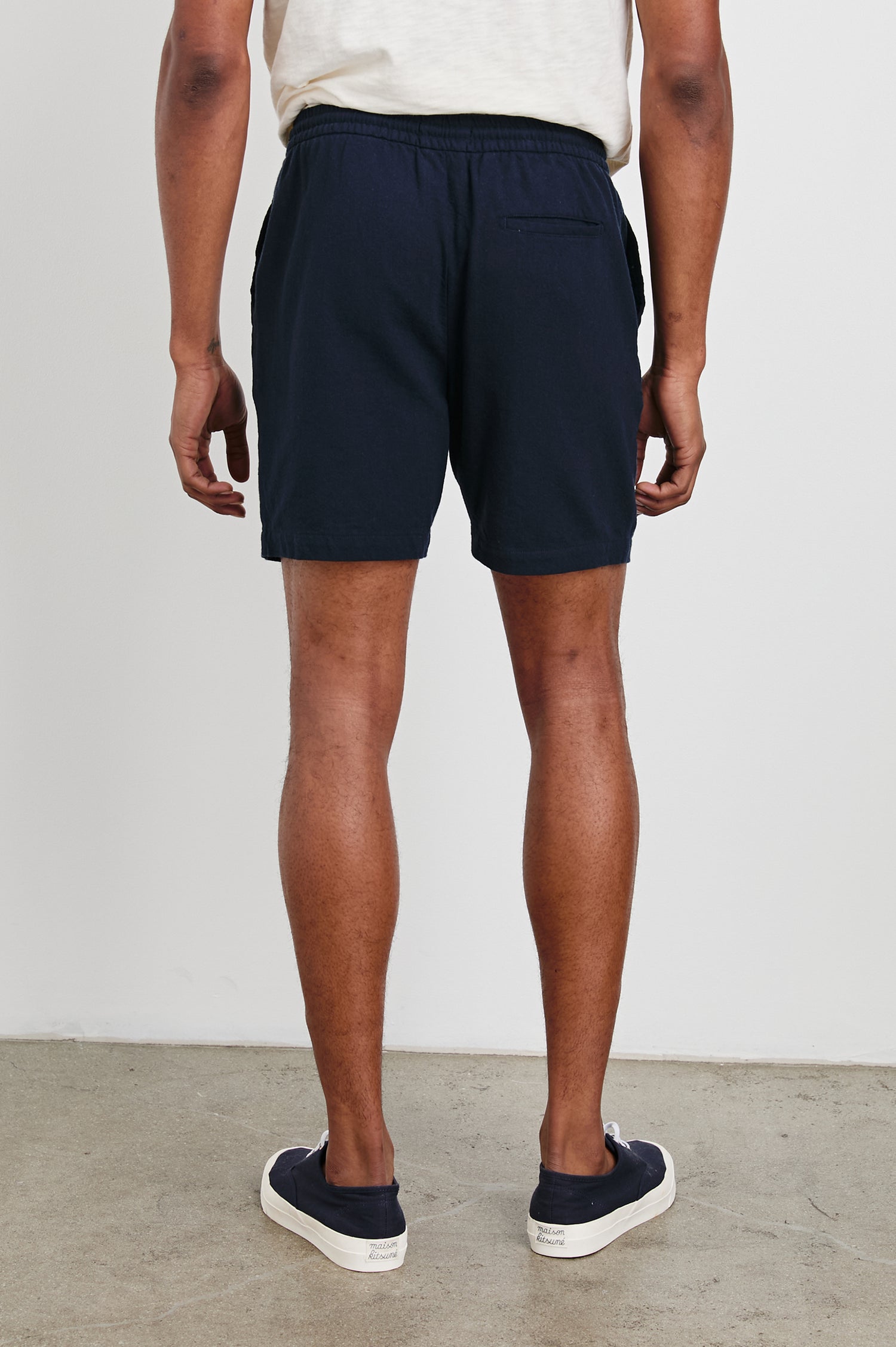 Archer Short in Cotton-Linen Blend With Relaxed Fit, Elastic Drawstring Waist, Front Zip Fly, Side Pockets, and Back Welt Pocket in Deep Meridian Colorway - Lower Body Back View Featured on Model
