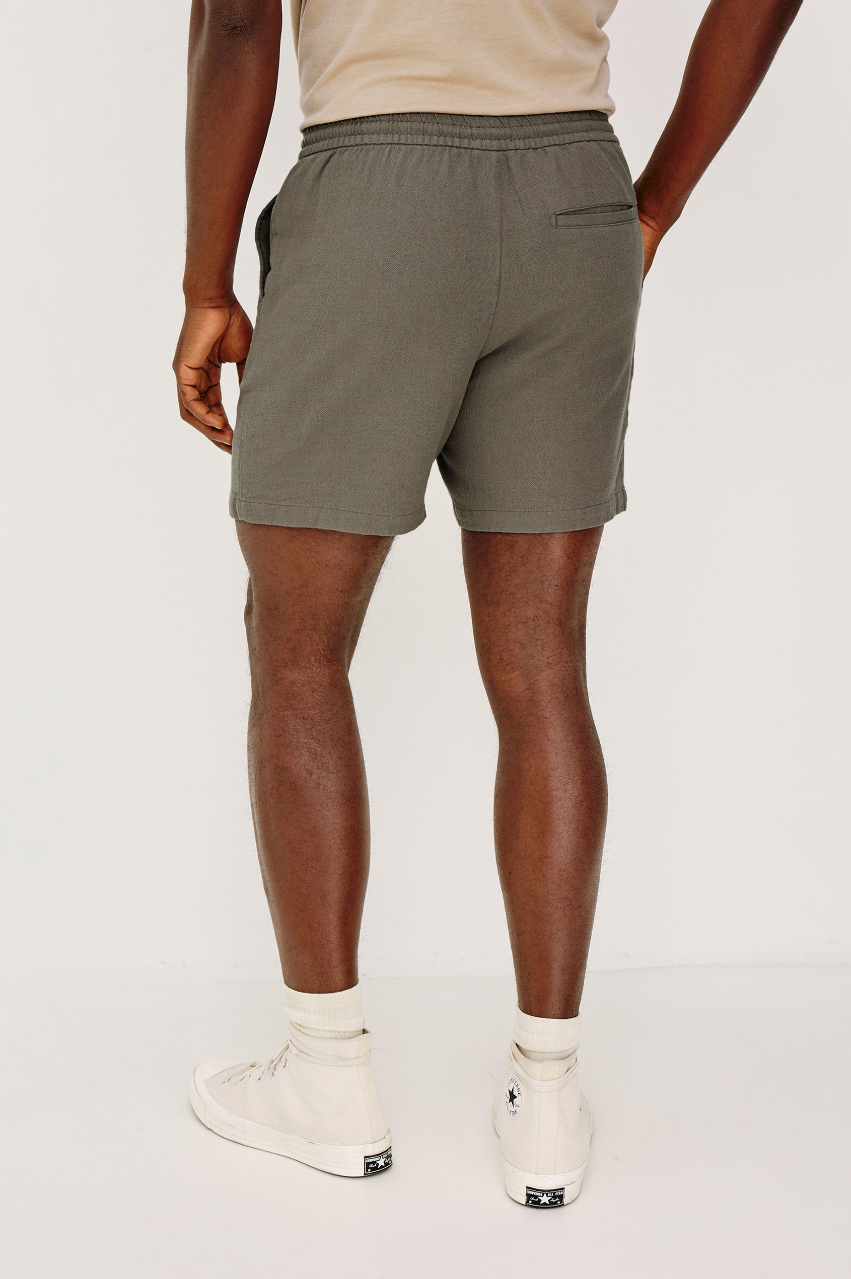 Archer Short in Unlined Cotton Linen With Relaxed Fit, Adjustable Waist Drawstring Ties, Side Pockts, and 6-Inch Inseam in Fallen Rock Colorway - Lower Body Back View Featured on Model