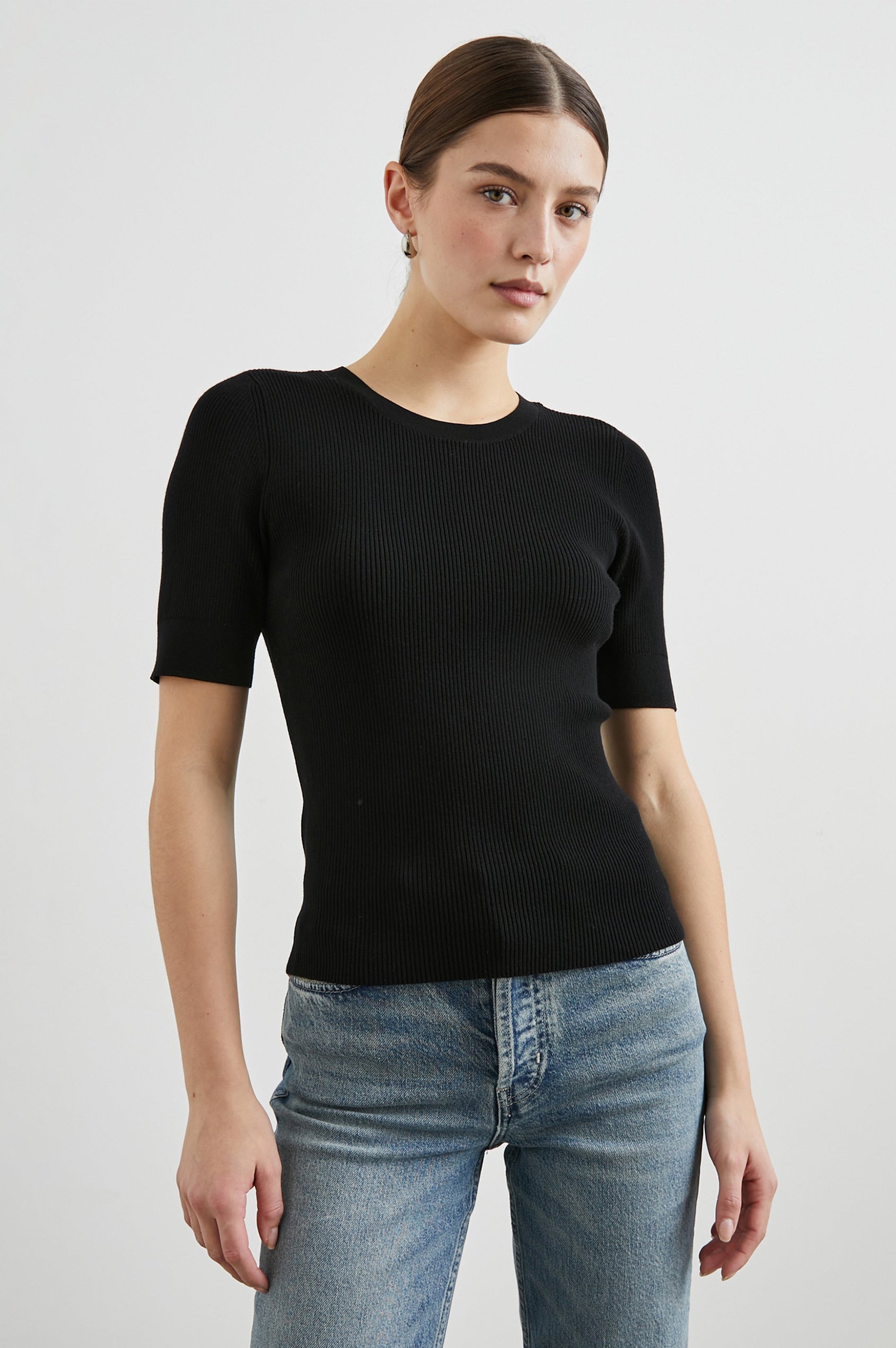 Ari Short-Sleeve Ribbed Top with a Crew Neck in Black Colorway - Front View Featured on Model