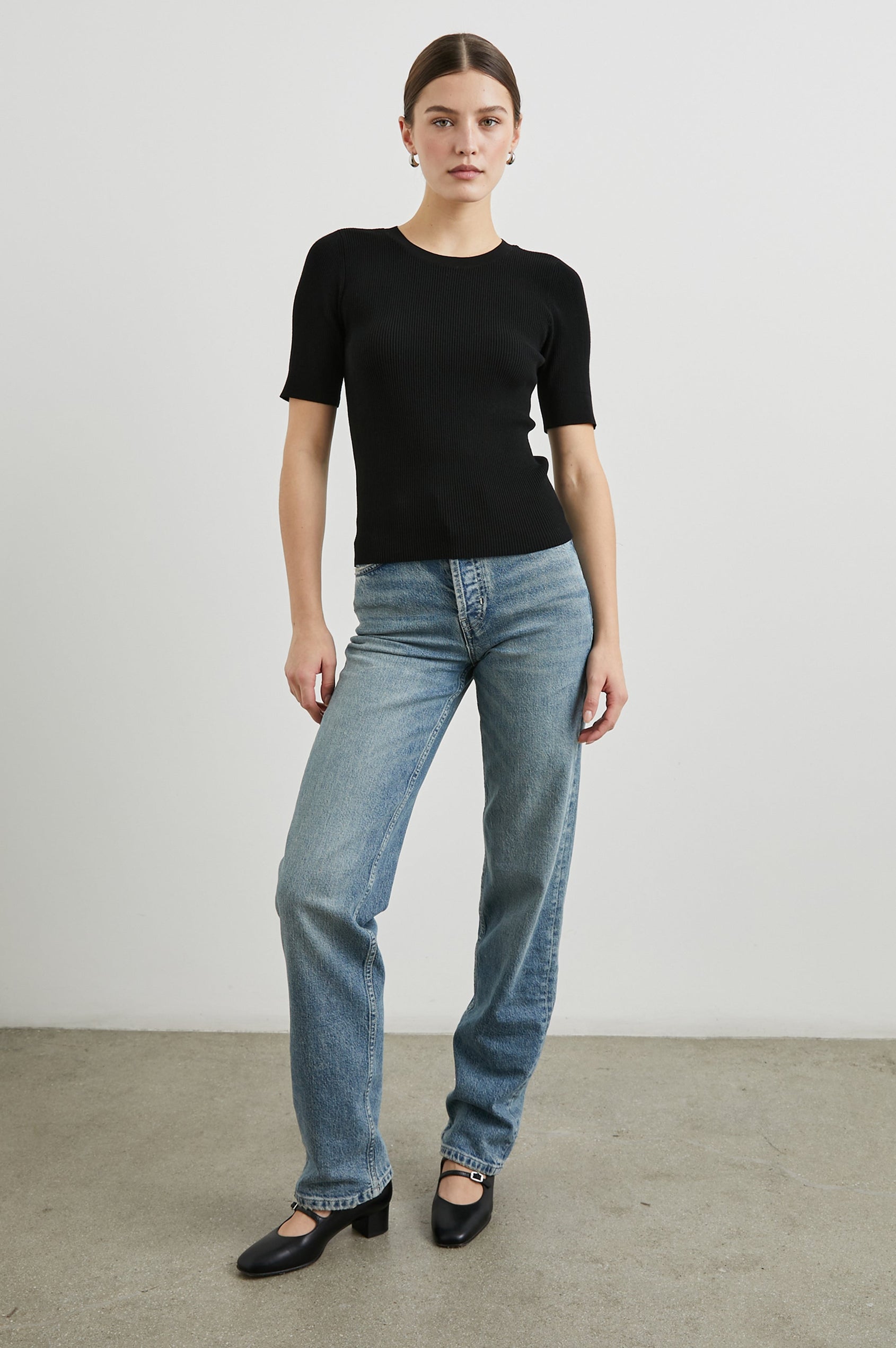 Ari Short-Sleeve Ribbed Top with a Crew Neck in Black Colorway - Front Full Body View Featured on Model