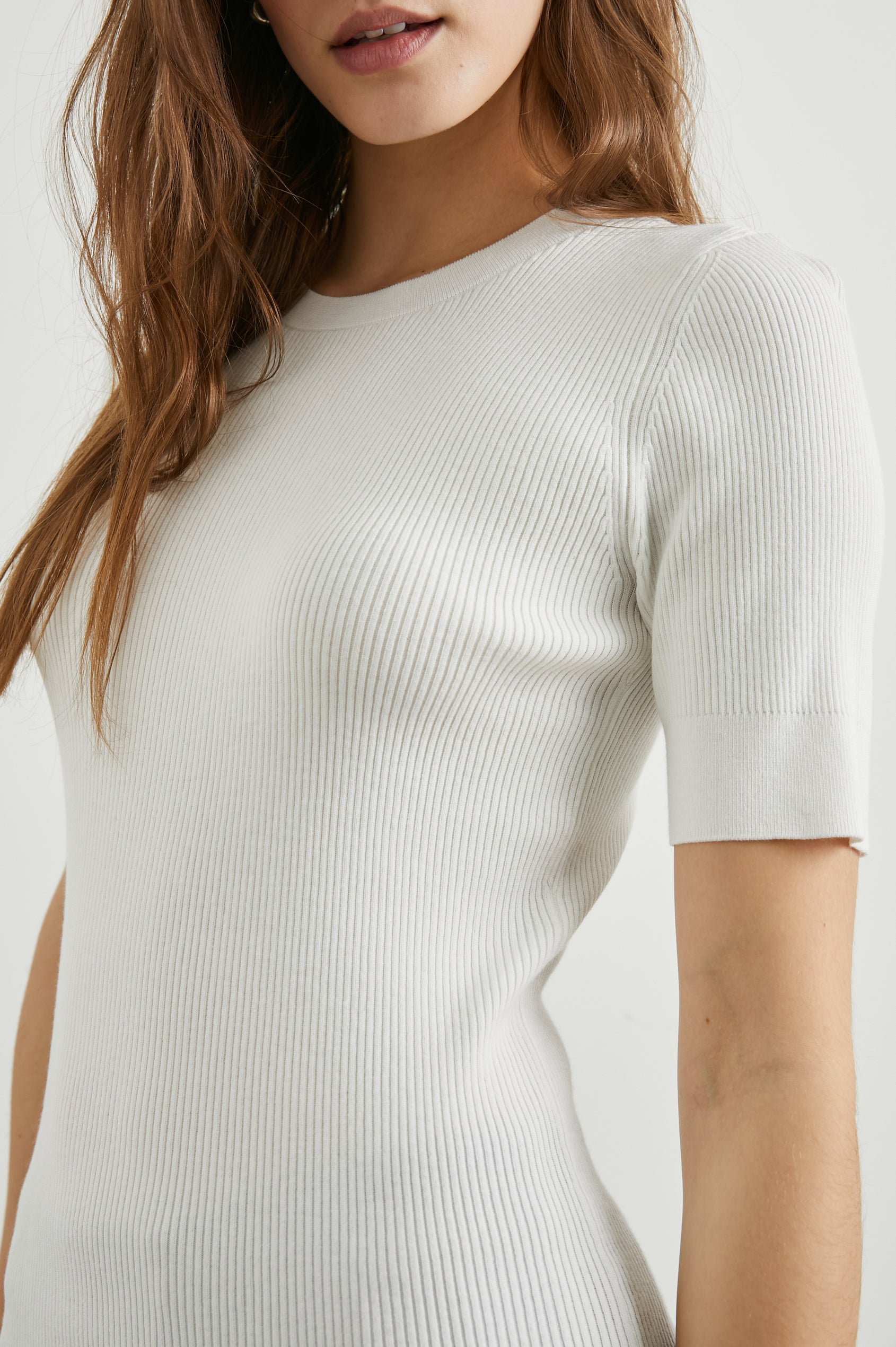 Ari Short-Sleeve Ribbed Top with a Crew Neck in White Colorway - Front View Featured on Model