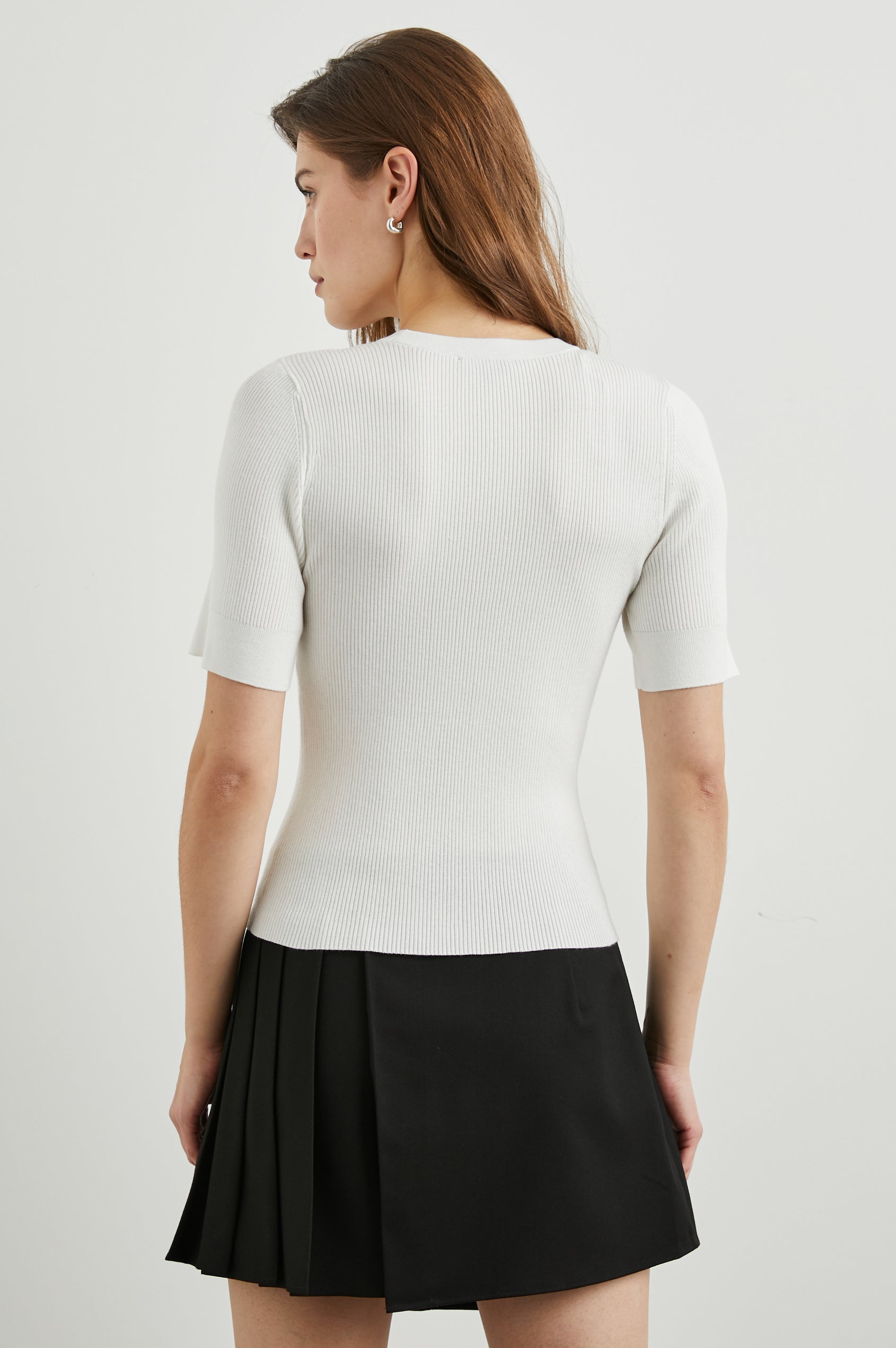 Ari Short-Sleeve Ribbed Top with a Crew Neck in White Colorway - Back View Featured on Model
