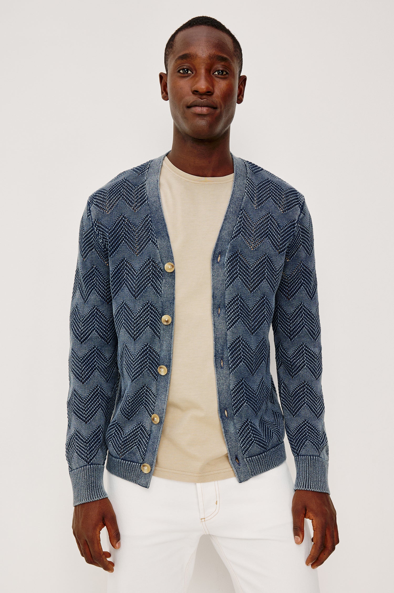 Ashe Cardigan Sweater in Jacquard Knit With Unique Spray-Wash Finish, Front Buttons, Regular Fit, and Long Sleeves in Sunfaded Navy Colorway - Upper Body Front View Featured on Model