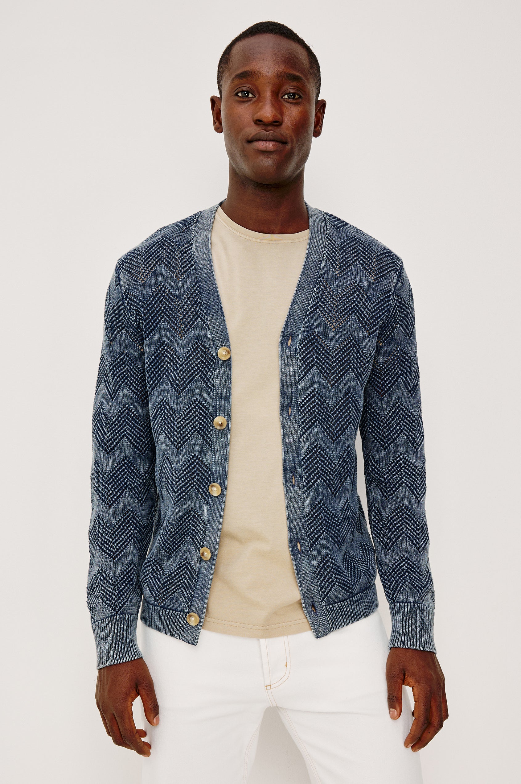 Ashe Cardigan Sweater in Jacquard Knit With Unique Spray-Wash Finish, Front Buttons, Regular Fit, and Long Sleeves in Sunfaded Navy Colorway - Upper Body Front View Featured on Model