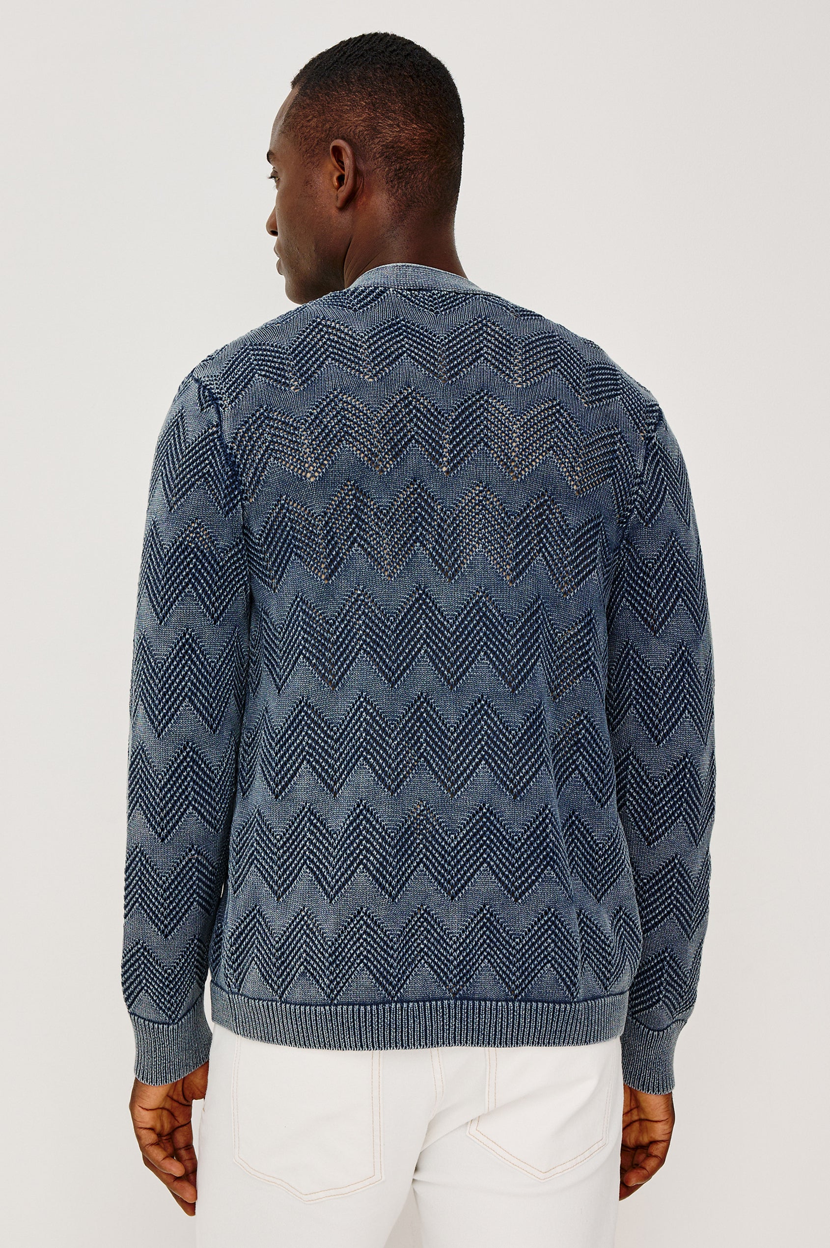 Ashe Cardigan Sweater in Jacquard Knit With Unique Spray-Wash Finish, Front Buttons, Regular Fit, and Long Sleeves in Sunfaded Navy Colorway - Upper Body Back View Featured on Model