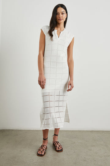 Ashley Short-Sleeve, Open Knit Midi Dress with Cap Sleeves, a V Neck Placket and a Side Slit in White Colorway - Front Full Body View Featured on Model 