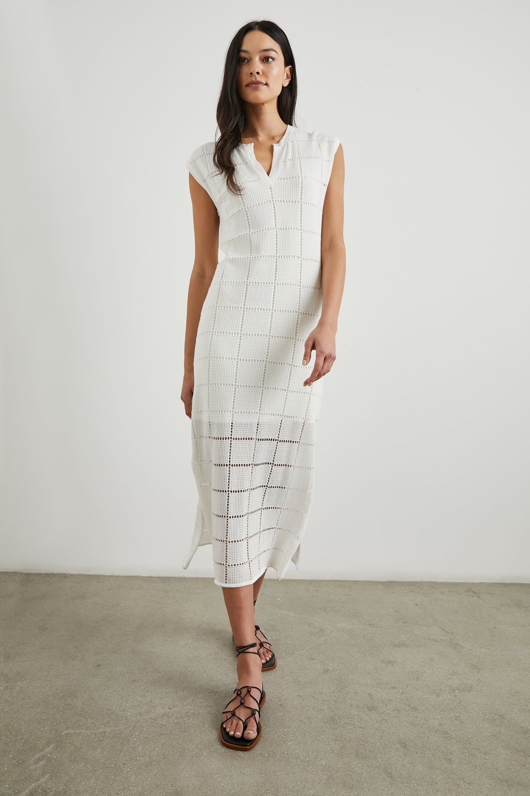 Ashley Short-Sleeve, Open Knit Midi Dress with Cap Sleeves, a V Neck Placket and a Side Slit in White Colorway - Front Full Body View Featured on Model 