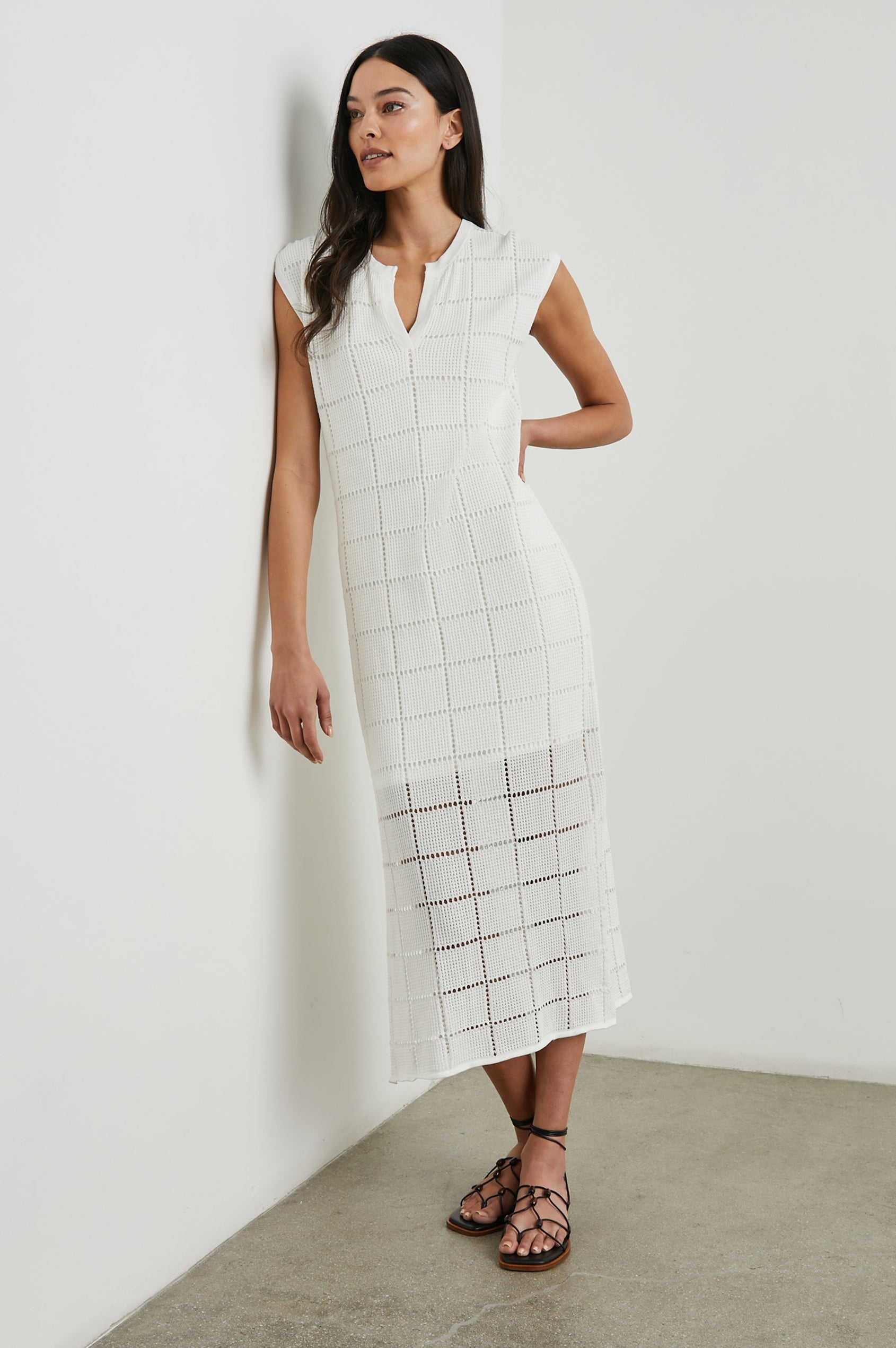 Ashley Short-Sleeve, Open Knit Midi Dress with Cap Sleeves, a V Neck Placket and a Side Slit in White Colorway - Front Full Body View Featured on Model 