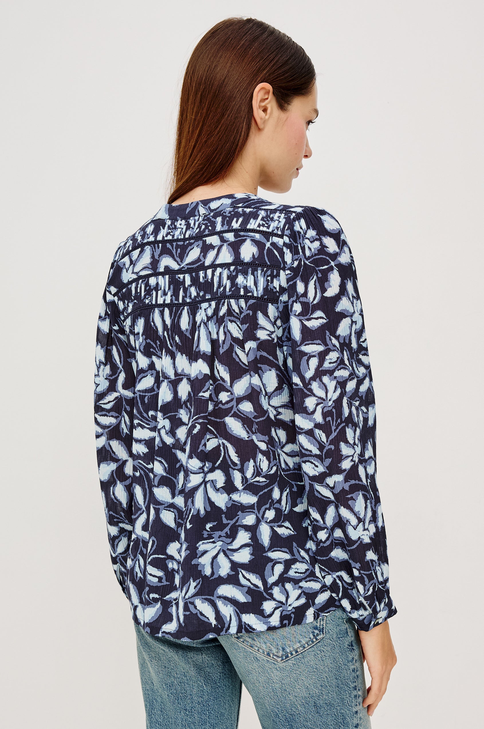 Asta Top in Floral Print Pleated Chiffon With V-Neckline, Inset Ladder Trim at Yoke, and Long Billowing Sleeves With Fitted Cuffs in Navy Jasmine Colorway - Upper Body Back View Featured on Model