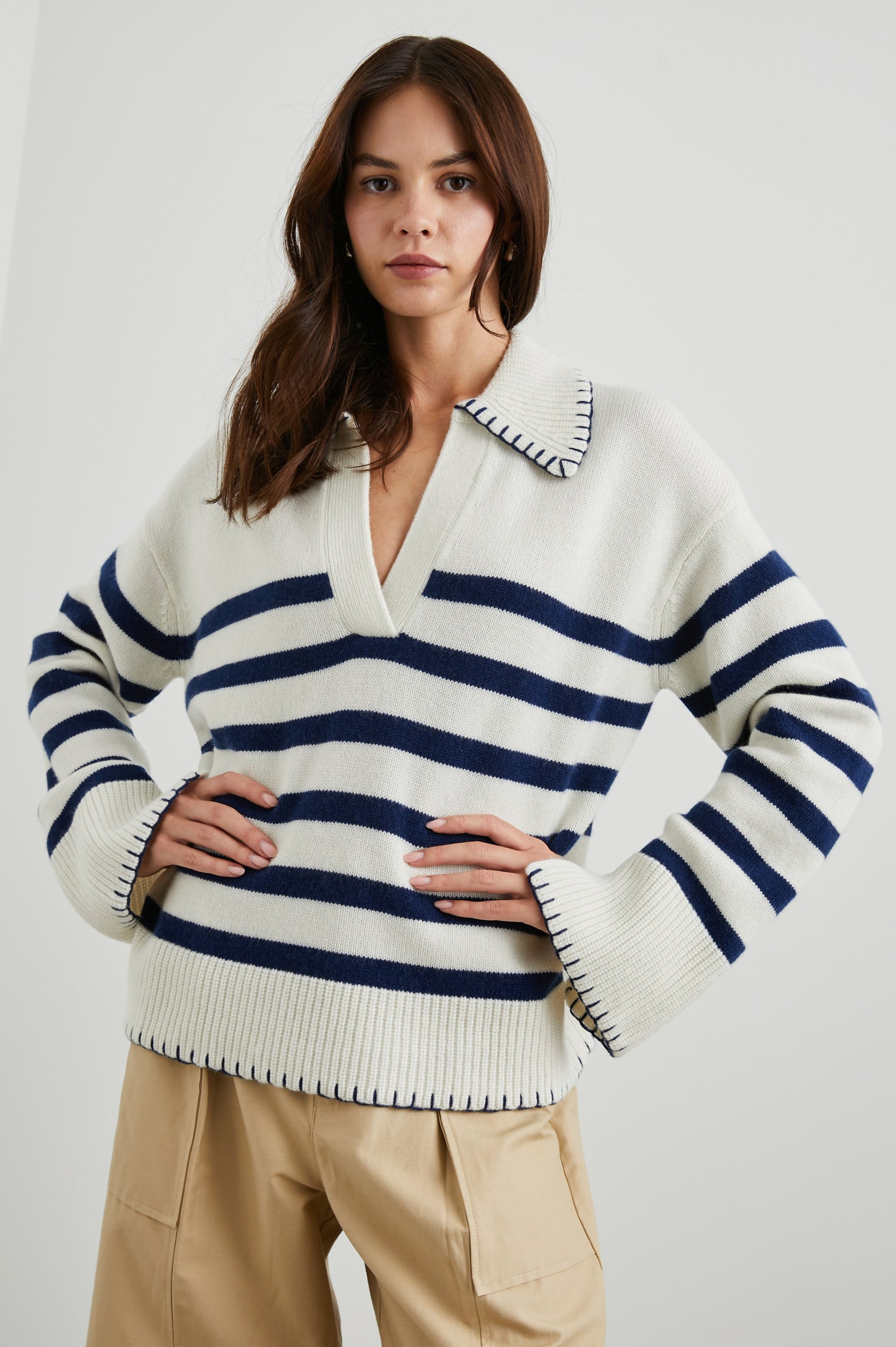 Athena Long-Sleeve Sweater with a Flat Collar V Neckline, Ribbed Cuffs and Hem and Contrast Stitching at the Cuffs and Hem in Ivory Navy Stripe Colorway, Horizontal Stripes - Front View Featured on Model 