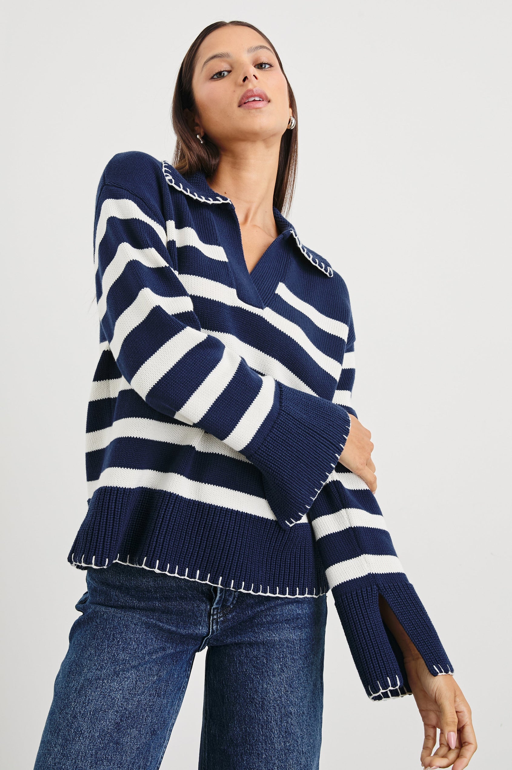 Athena Long-Sleeve Sweater with a Flat Collar V Neckline, Ribbed Cuffs and Hem and Contrast Stitching at the Cuffs and Hem in Navy Ivory Stripe Colorway, Horizontal Stripes - Front View Featured on Model 
