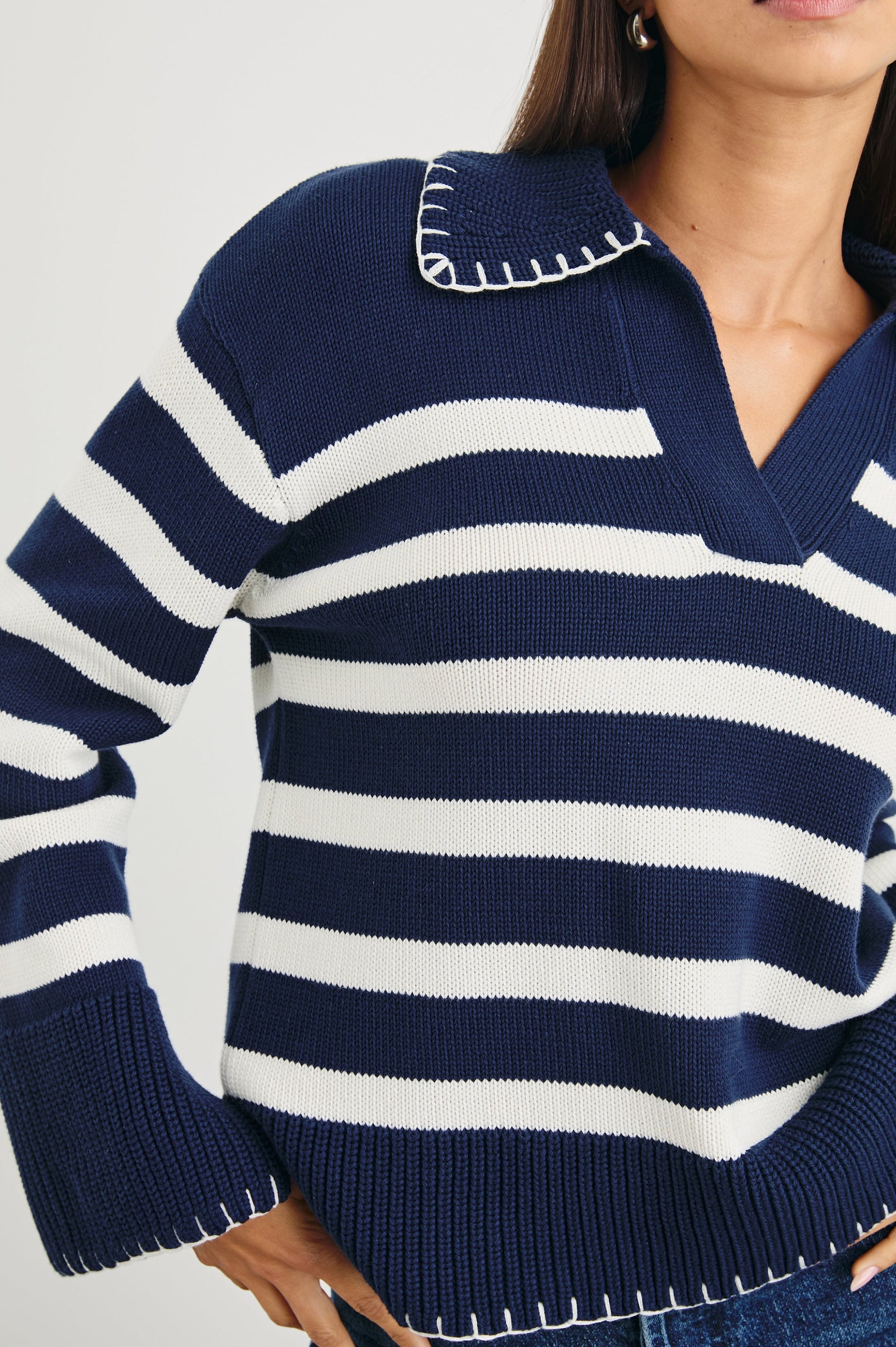 Athena Long-Sleeve Sweater with a Flat Collar V Neckline, Ribbed Cuffs and Hem and Contrast Stitching at the Cuffs and Hem in Navy Ivory Stripe Colorway, Horizontal Stripes - Front View Featured on Model 