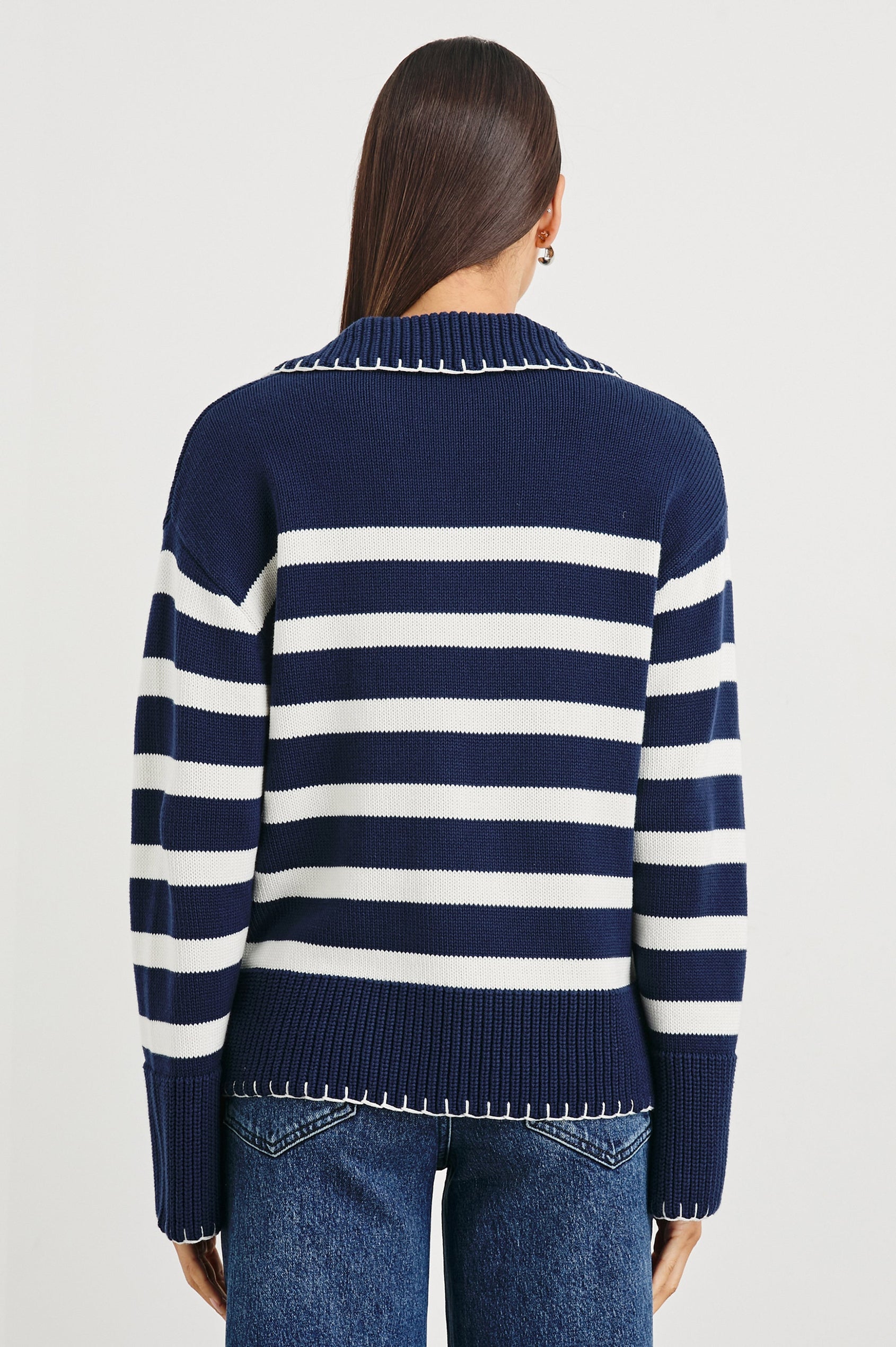 Athena Long-Sleeve Sweater with a Flat Collar V Neckline, Ribbed Cuffs and Hem and Contrast Stitching at the Cuffs and Hem in Navy Ivory Stripe Colorway, Horizontal Stripes - Back View Featured on Model 
