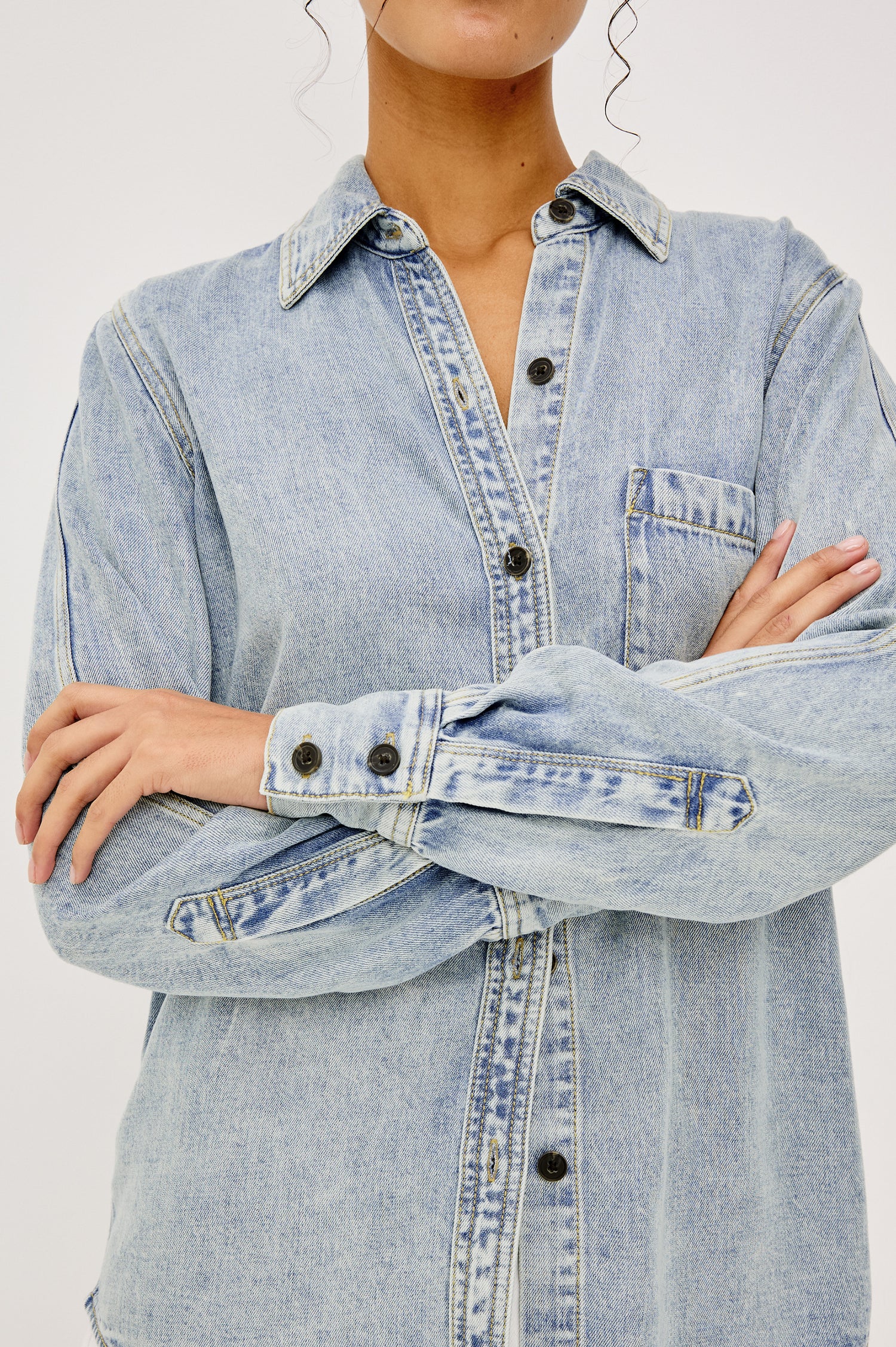 Atticus Long-Sleeve Denim Style Button Up with Chest Patch Pocket in Bleached Indigo Colorway - Upper Body Front View Zoomed In Details Featured on Model
