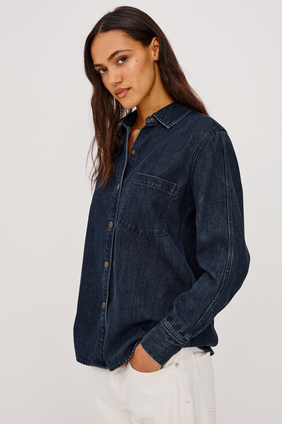 Atticus Shirt in TENCEL Denim With Relaxed Fit, Point Collar, Front Button, and Long Sleeves With Flat-Felled Seams and Buttoned Cuffs in Blue Ridge Colorway - Full Body Front View Featured on Model