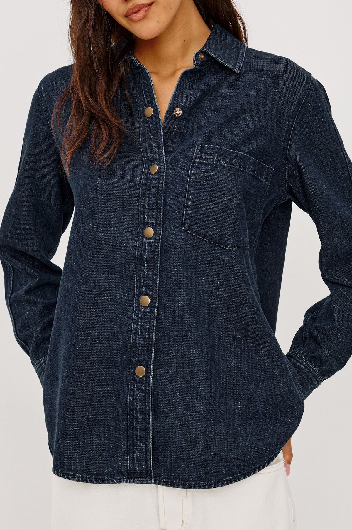 Atticus Shirt in TENCEL Denim With Relaxed Fit, Point Collar, Front Button, and Long Sleeves With Flat-Felled Seams and Buttoned Cuffs in Blue Ridge Colorway - Upper Body Close Up View Featured on Model