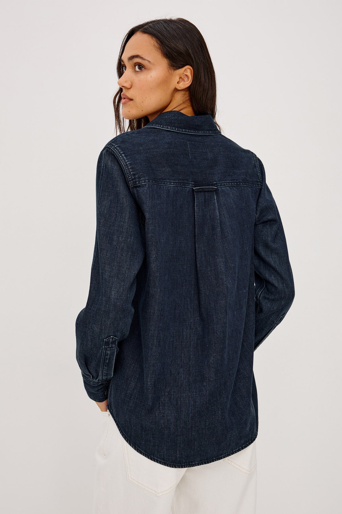 Atticus Shirt in TENCEL Denim With Relaxed Fit, Point Collar, Front Button, and Long Sleeves With Flat-Felled Seams and Buttoned Cuffs in Blue Ridge Colorway - Upper Body Back View Featured on Model