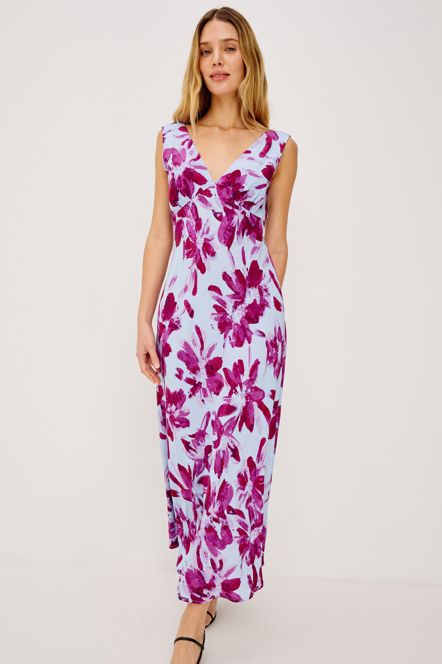 Audrina Sleeveless Midi Dress with Wide Shoulder Straps, a Deep V Neck and V-Back, and an Empire Waist in Blue Lily Colorway - full body front view on model