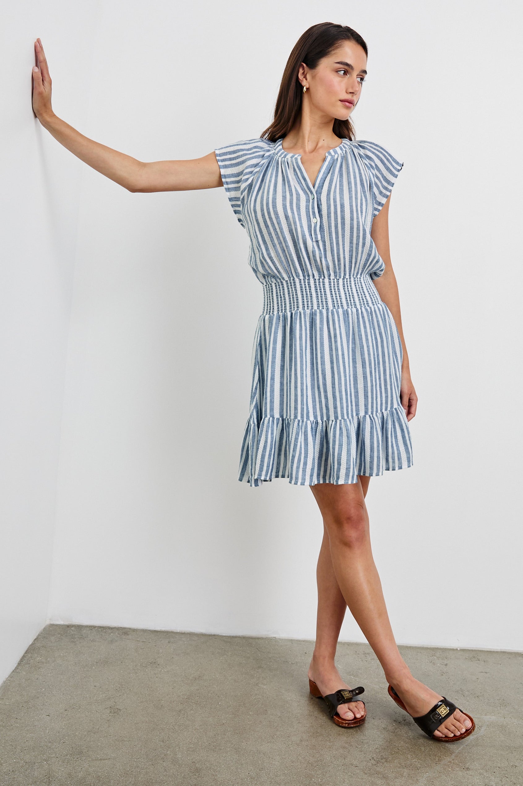 Augustine Mini Dress with Flutter Sleeves, V-Neck Button Front, Elastic Gathered Waist and a Tiered Flounce Hem in Jalisco Stripe Colorway. Full Body Front View Shown on Model.