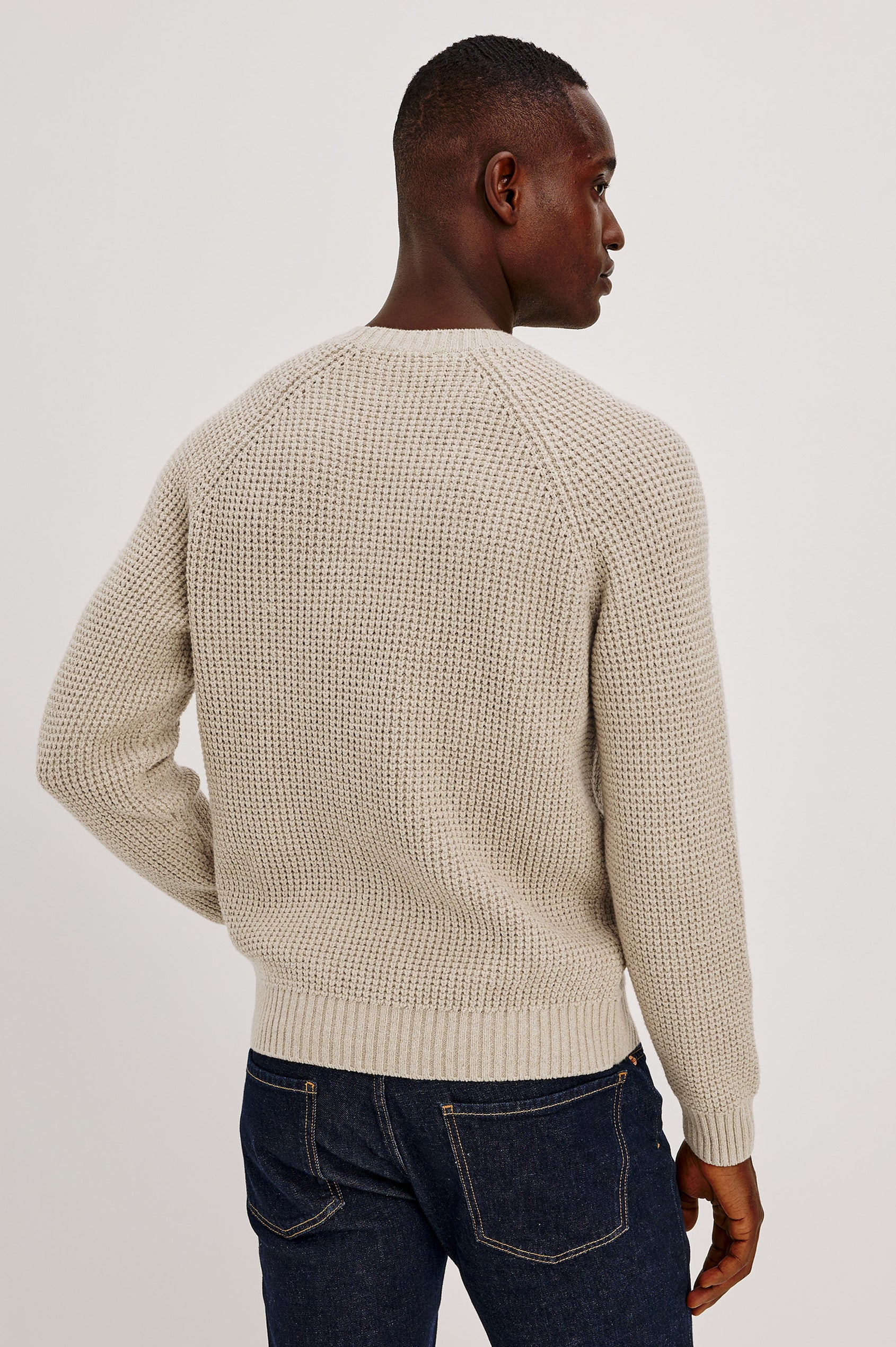 Augustus Sweater in Midweight Cotton-Linen Knit With Thermal Stitch, Textured Bouclé Finish, Raglan Long Sleeves, and Ribbed Trim in Vellum Colorway - Upper Body Back View Featured on Model