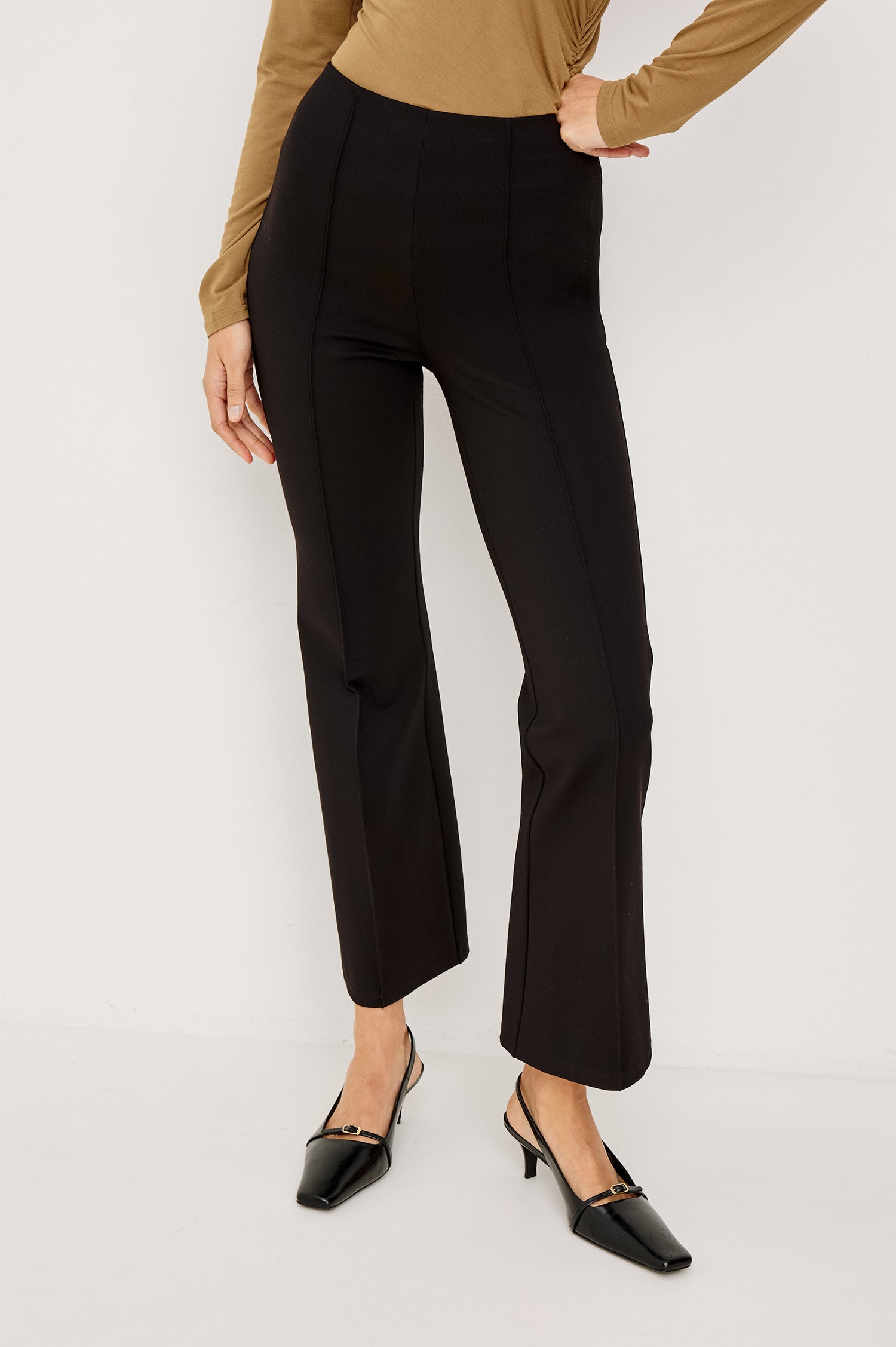 Auray High-Waisted Pant in Ponte With Pintuck Front Seams, Cropped Legs, Elastic Waistband, and Kick Flare in Black Colorway - Lower Body Front View Featured on Model
