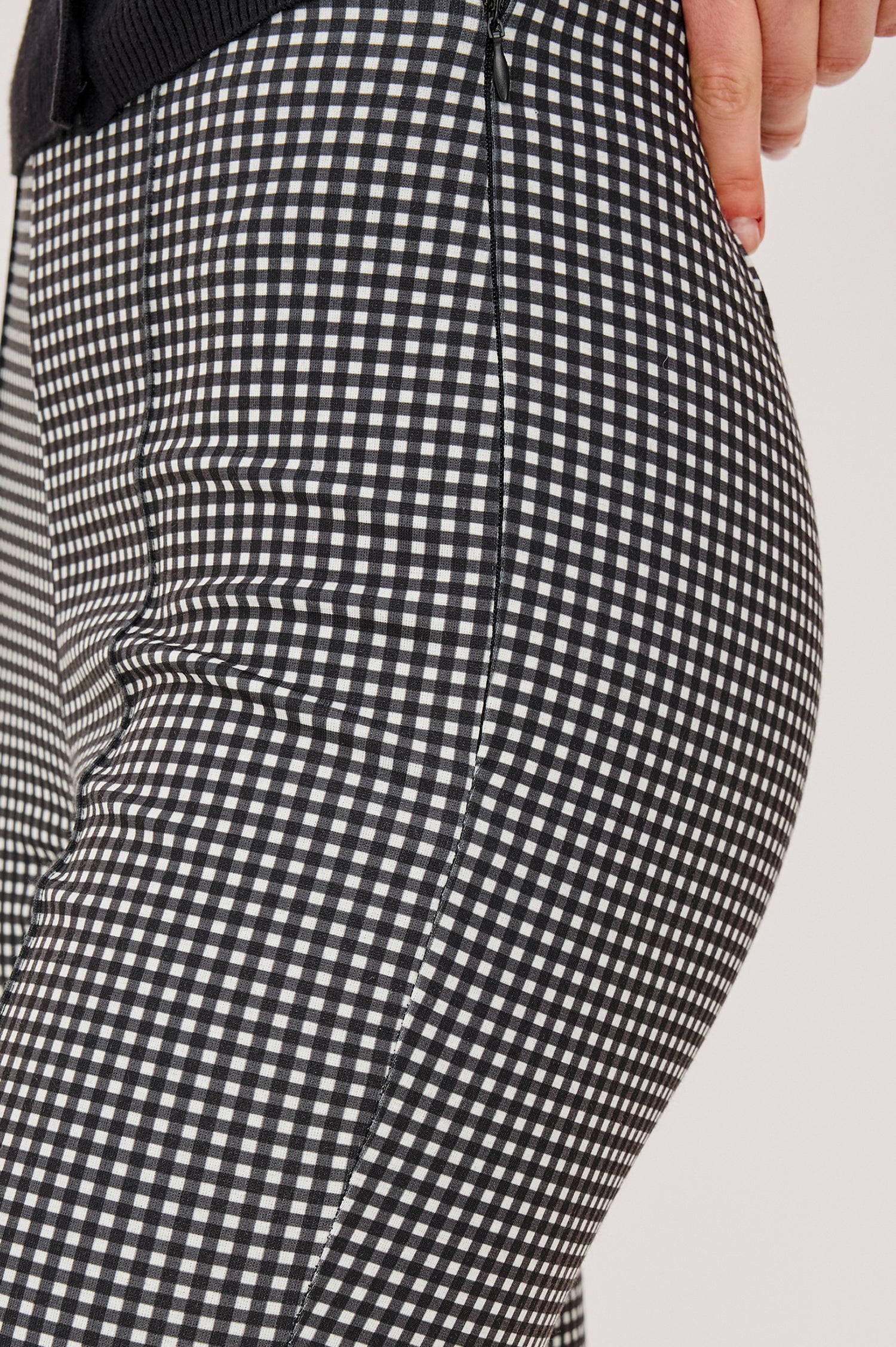 Auray Pant in Ponte With High-Waisted Fit Front Pintuck Detailing Cropped Length Elastic Waistband and Kick Flare at Hem in Black Gingham Colorway - Lower Body Close Up View Featured on Model