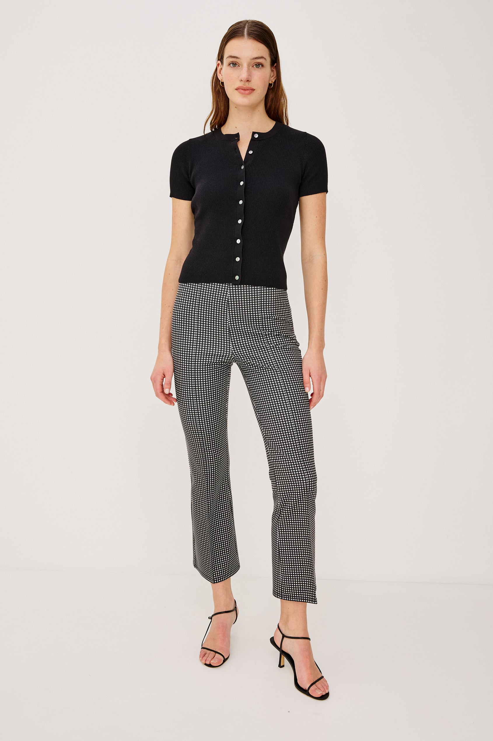 Auray High-Waisted Pant in Ponte With Pintuck Front Seams Cropped Legs Elastic Waistband and Kick Flare in Black Colorway - Lower Body Front View Featured on Model