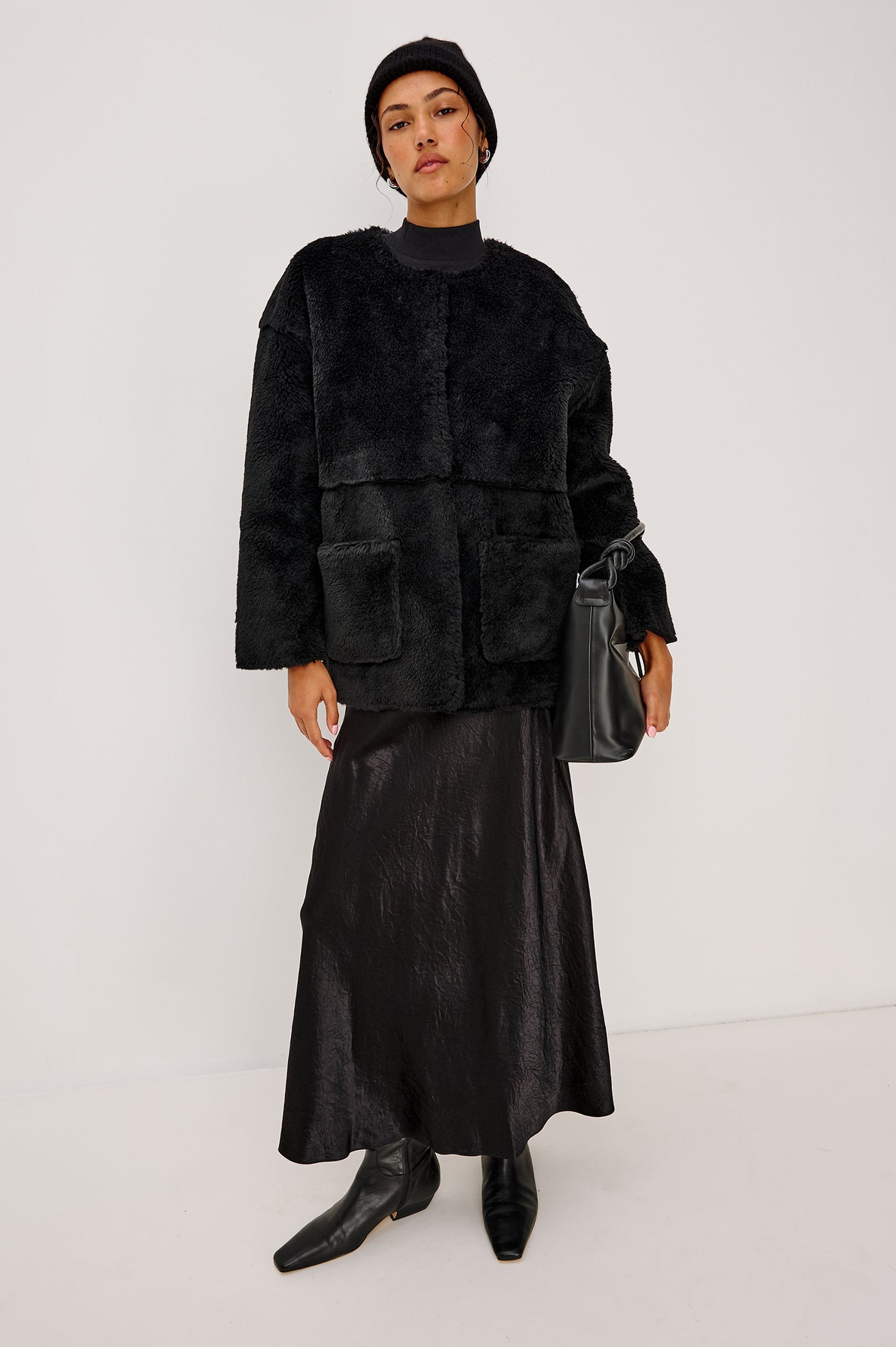 Autumn Cashmere Silk Cuffed Beanie in Black Colorway. Front full body View Featured on Model.