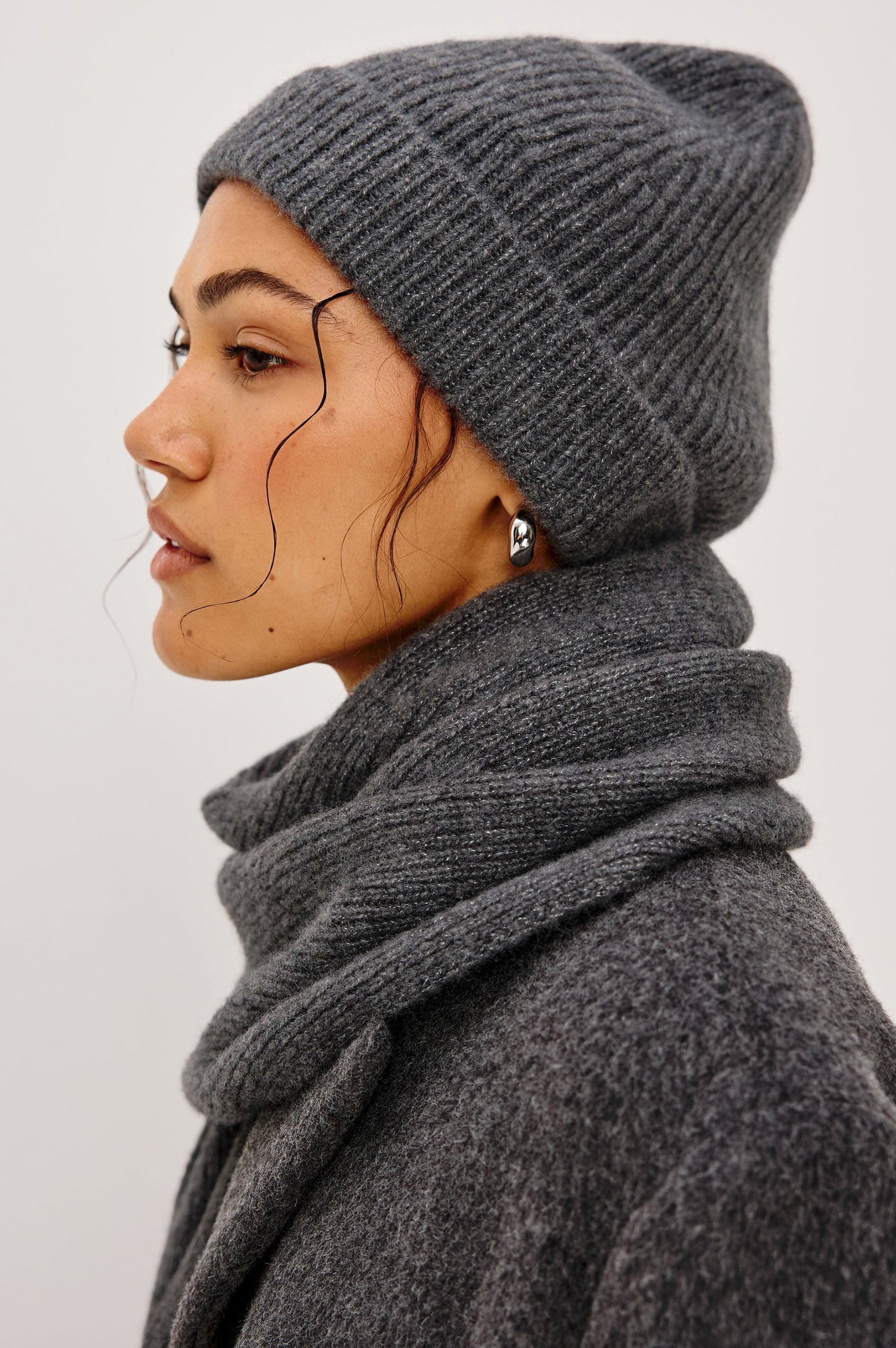 Autumn Cashmere Silk Cuffed Beanie in Thunder Colorway. Side view featured on model.