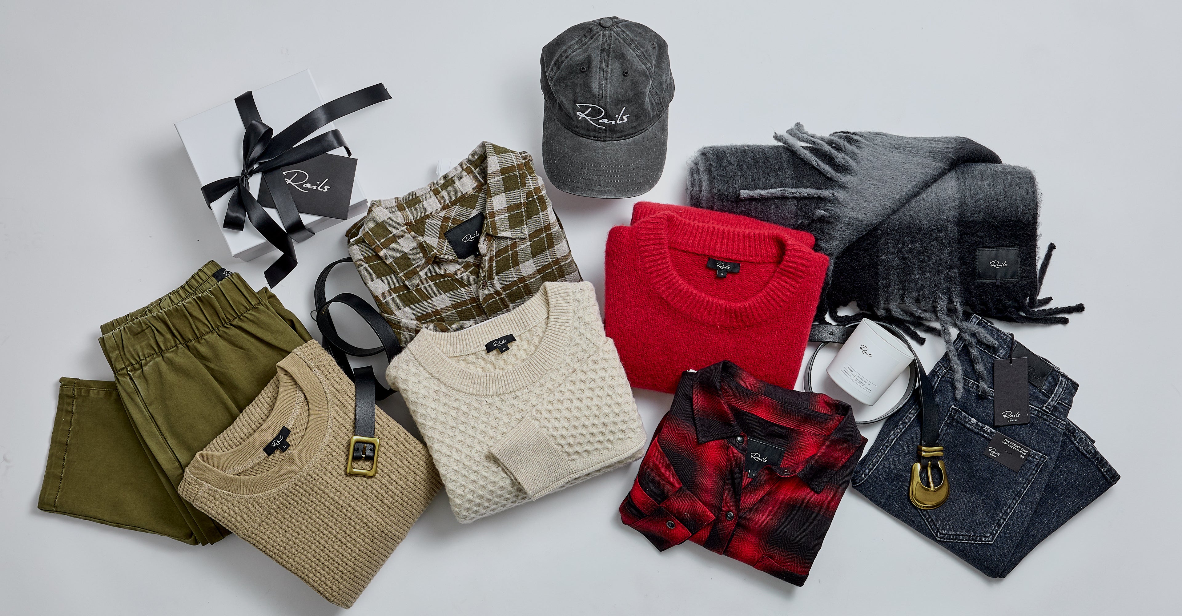 EDITORIAL IMAGE OF MULTIPLE SHIRTS AND SWEATERS ALL FOLDED TOGETHER